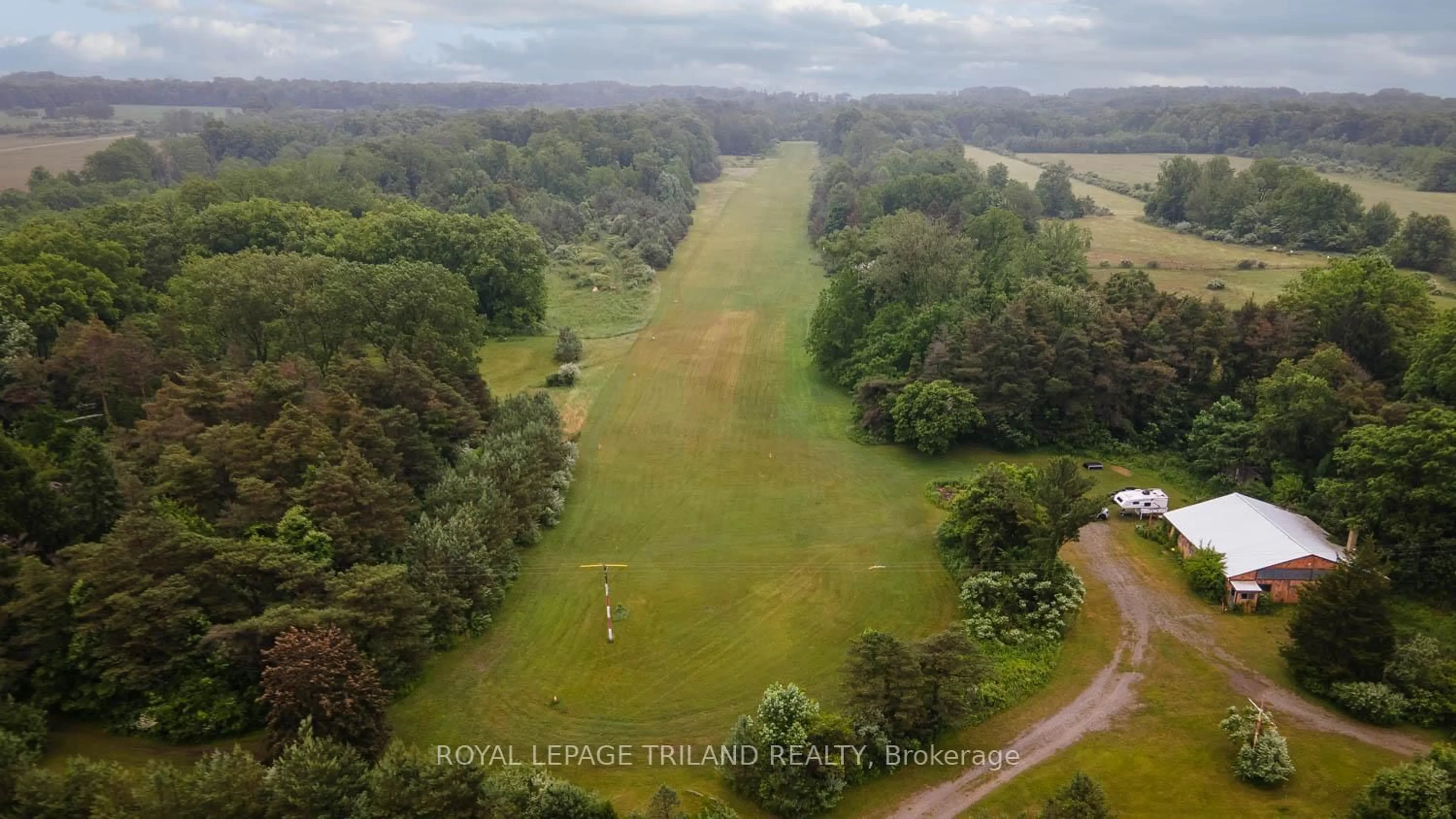 A pic from outside/outdoor area/front of a property/back of a property/a pic from drone, forest/trees view for 23171 Talbot Line, West Elgin Ontario N0L 2C0