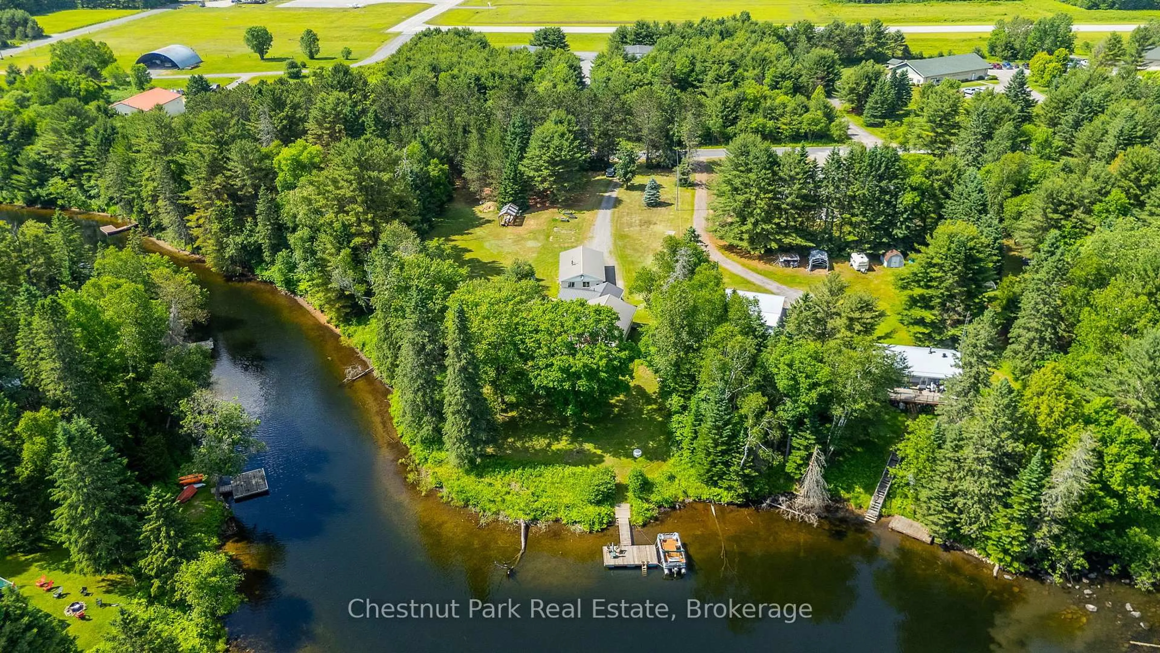 A pic from outside/outdoor area/front of a property/back of a property/a pic from drone, water/lake/river/ocean view for 1054 Green Lake Rd, Algonquin Highlands Ontario K0M 1J1