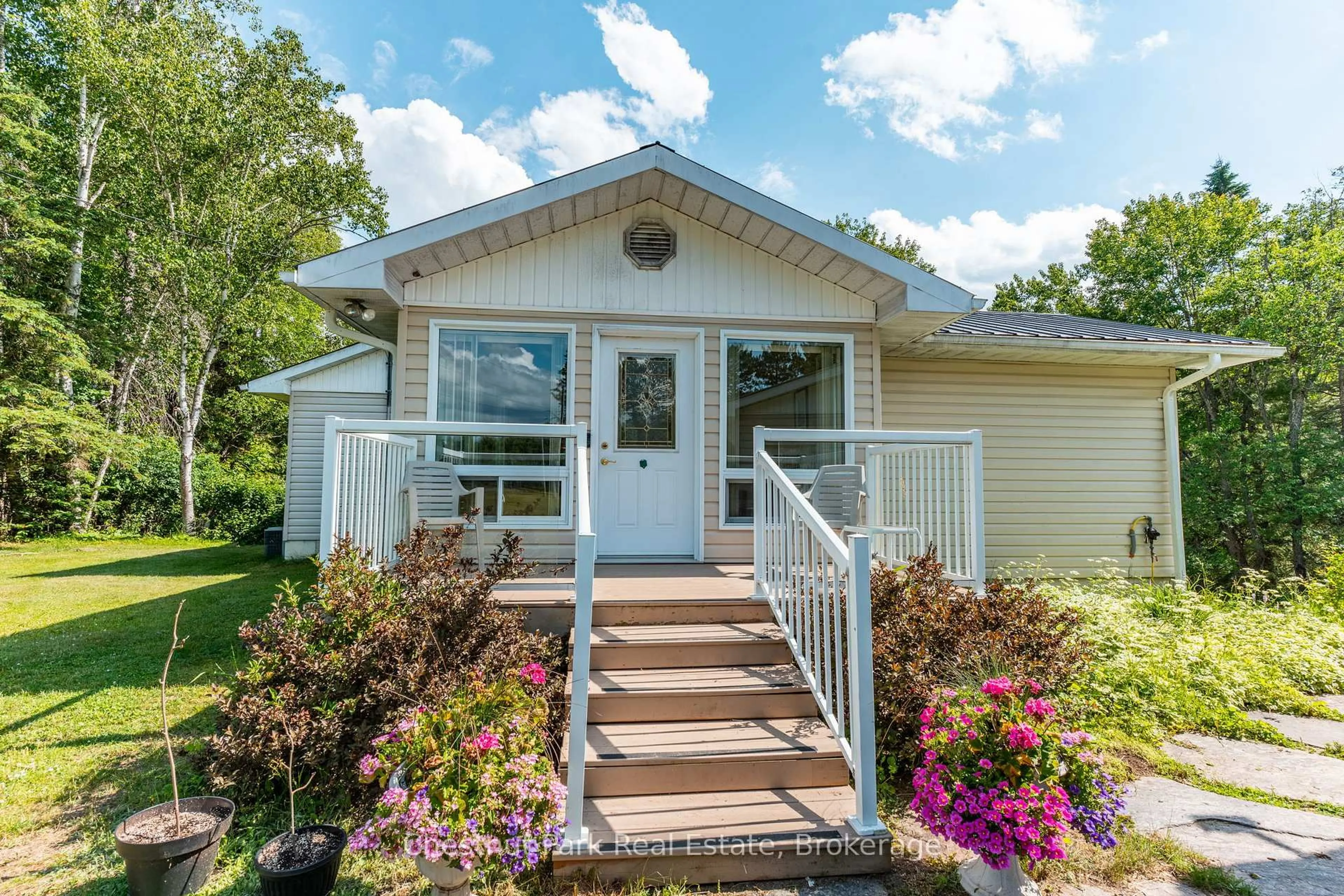 Home with vinyl exterior material, street for 1054 Green Lake Rd, Algonquin Highlands Ontario K0M 1J1
