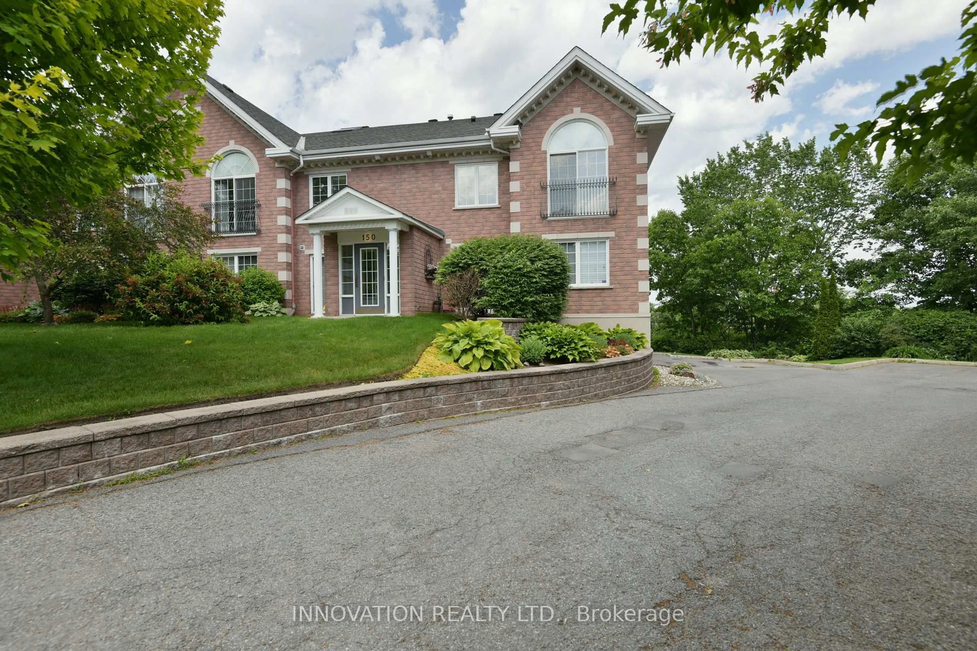 A pic from outside/outdoor area/front of a property/back of a property/a pic from drone, street for 150 Robson Crt #2C, Ottawa Ontario K2K 2W1