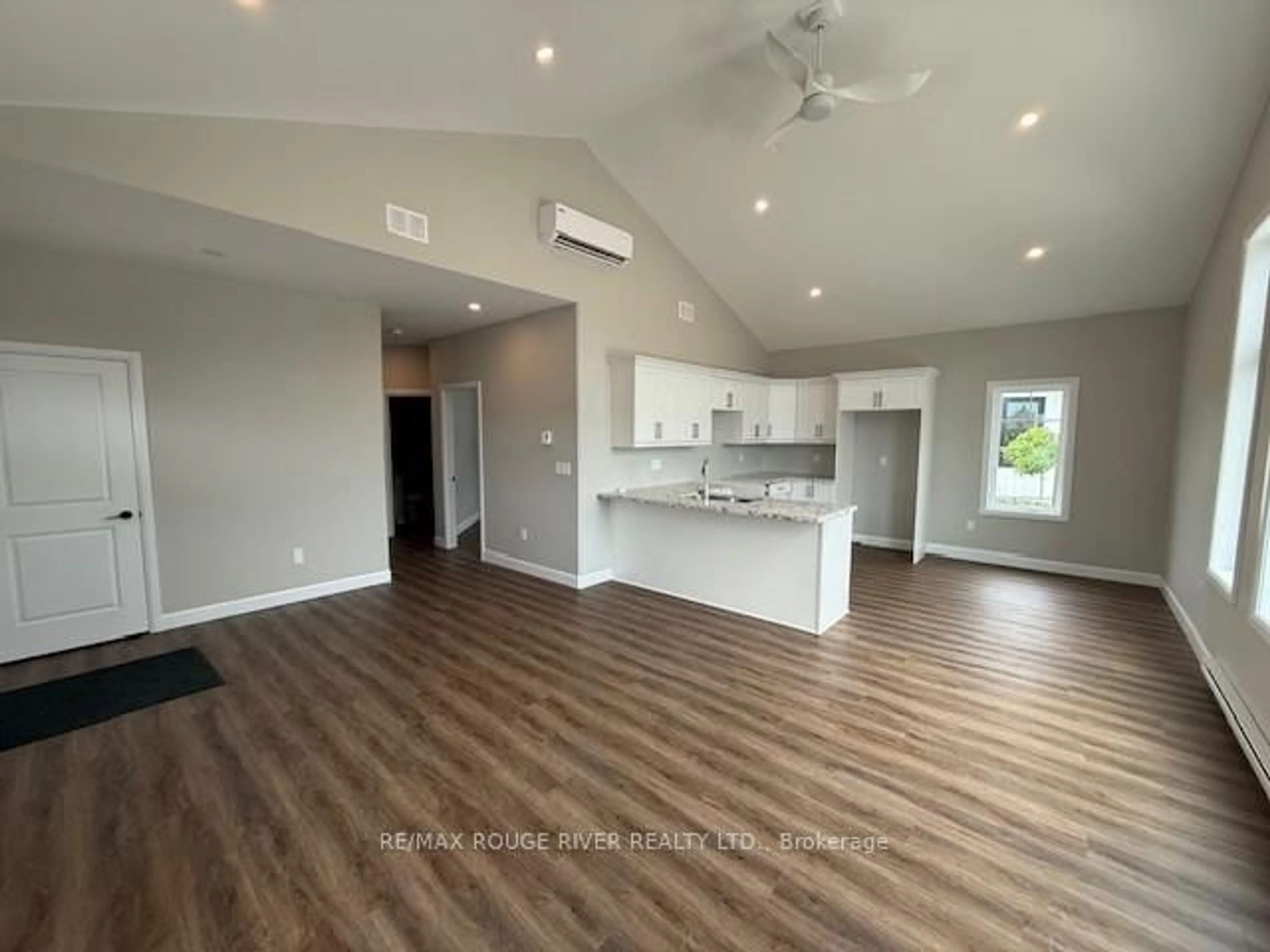 Open concept kitchen, wood/laminate floor for 14 MEADOWCREEK Dr #201, Brighton Ontario K0K 1H0