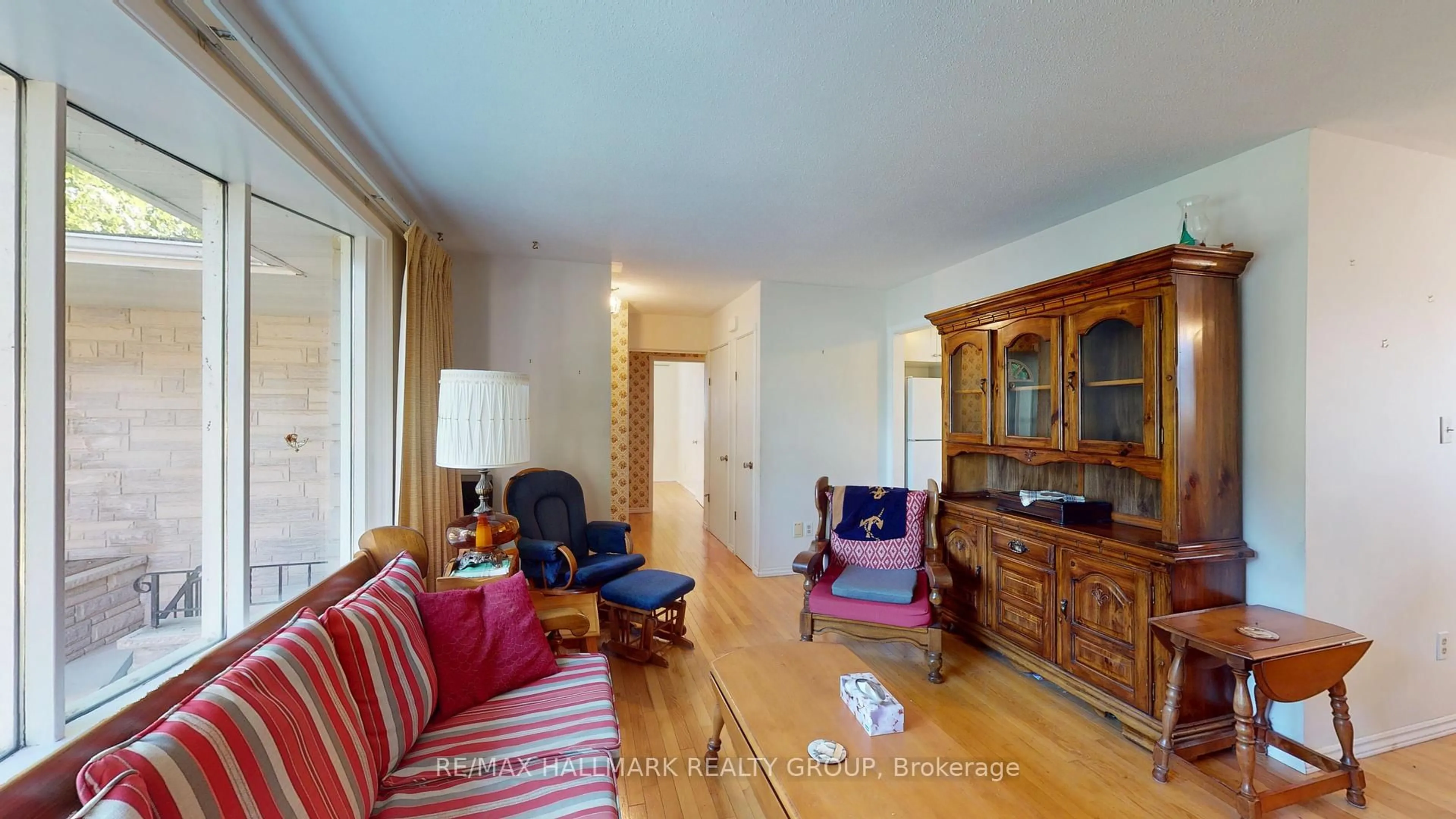 Living room with furniture, wood/laminate floor for 730 Dempster Dr, Gananoque Ontario K7G 2E7