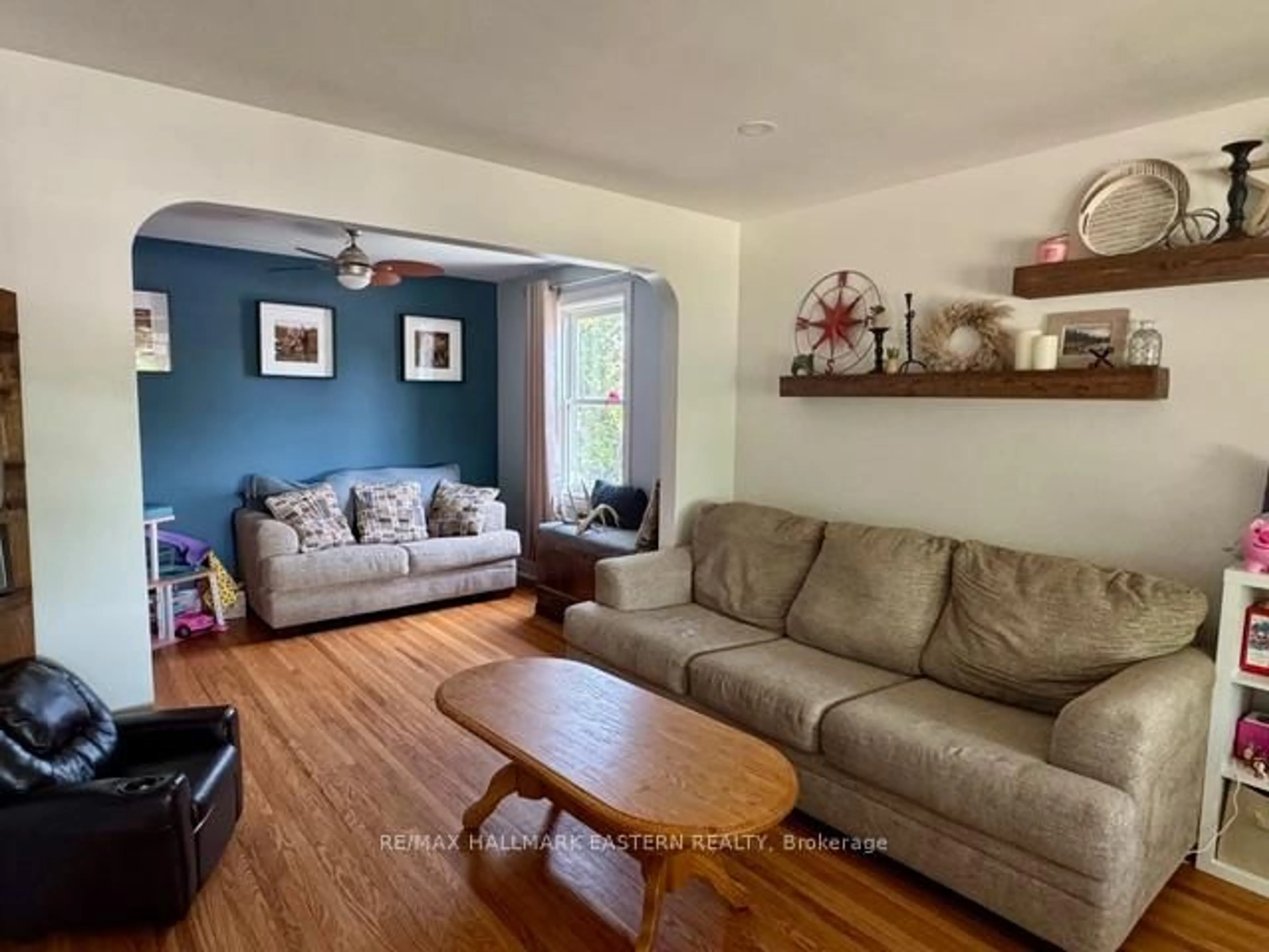Living room with furniture, wood/laminate floor for 1110 Hayes St, Peterborough Central Ontario K9J 5S8