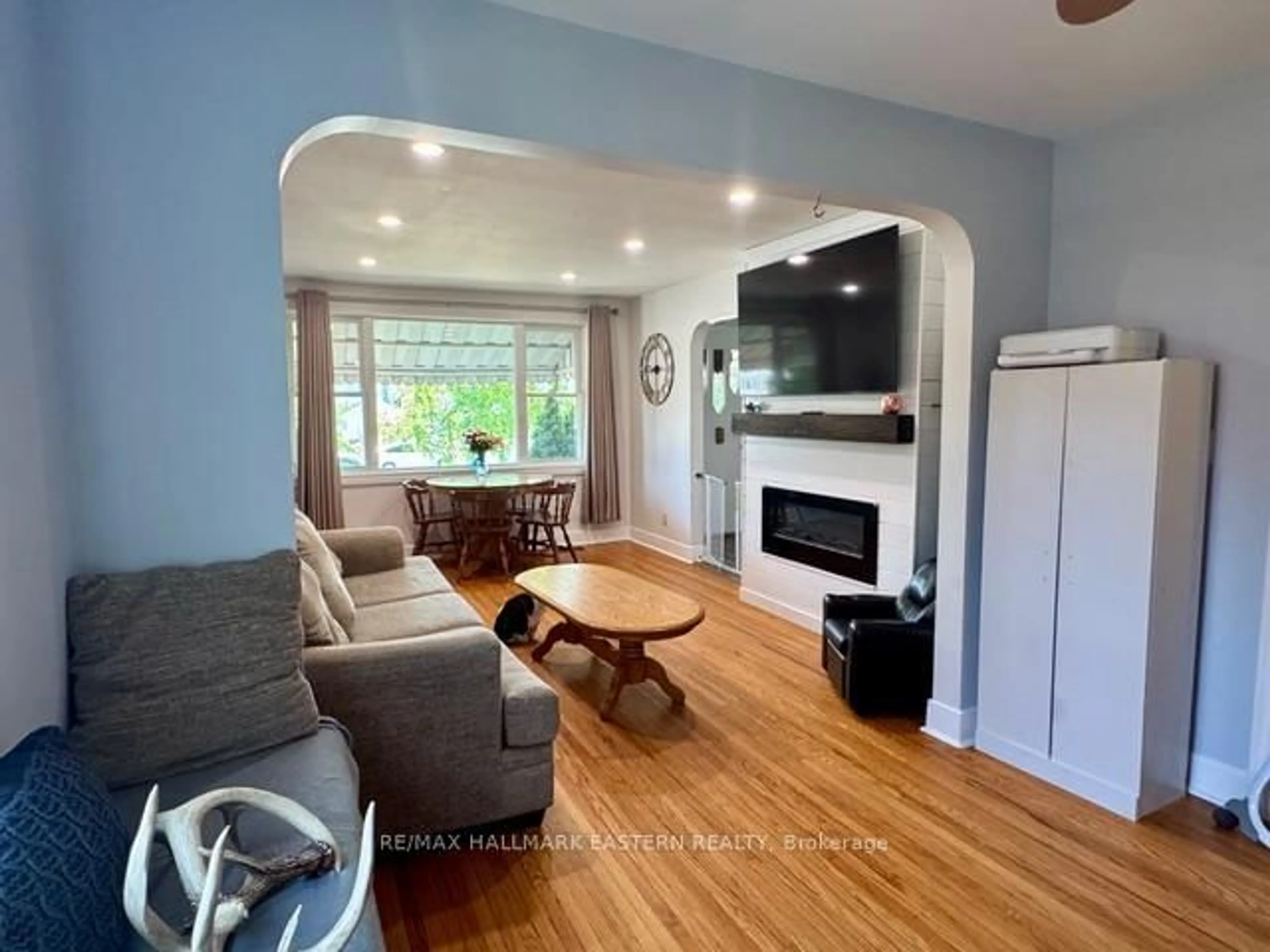 Living room with furniture, wood/laminate floor for 1110 Hayes St, Peterborough Central Ontario K9J 5S8