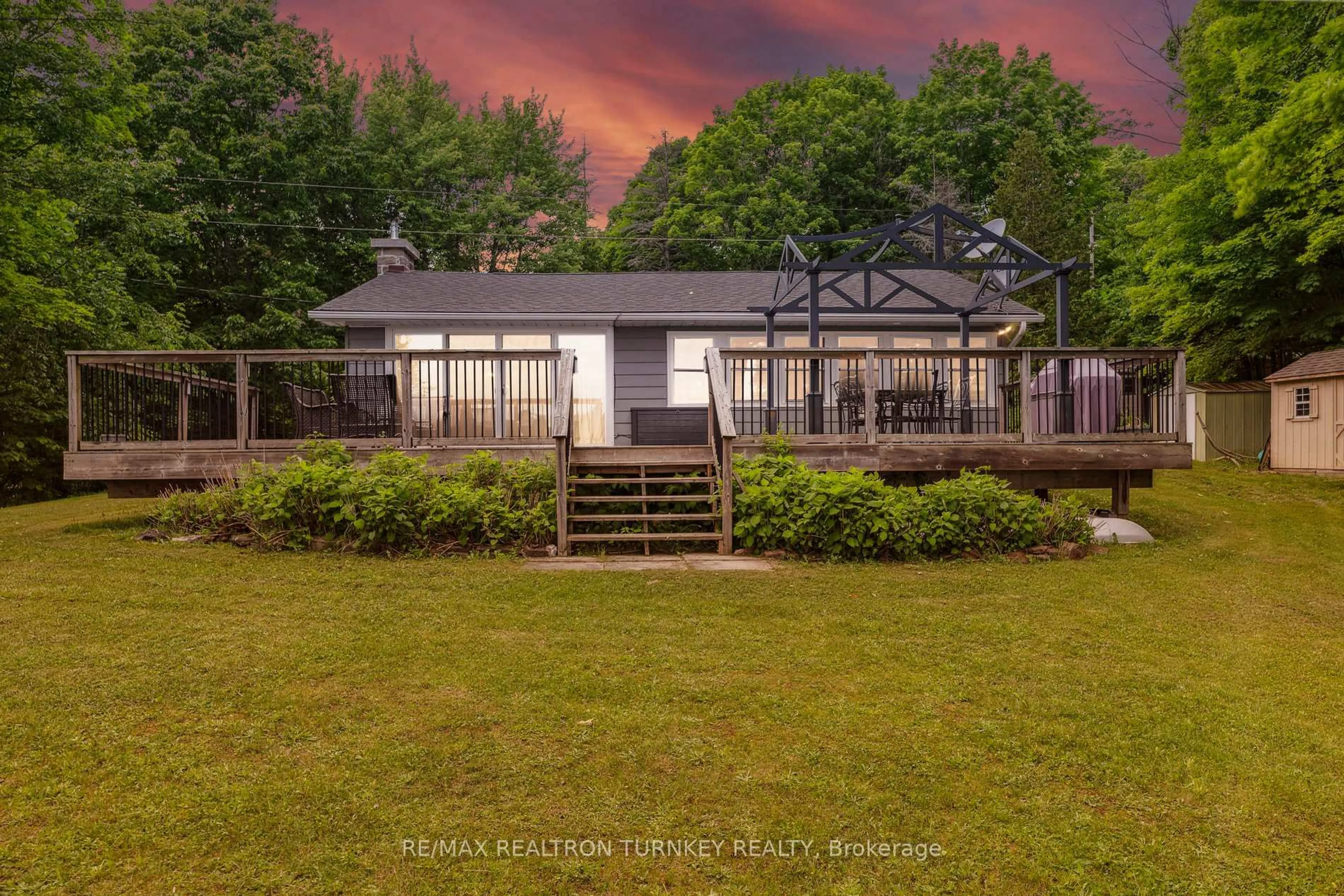 A pic from outside/outdoor area/front of a property/back of a property/a pic from drone, water/lake/river/ocean view for 310 Northern Ave, Trent Lakes Ontario K0M 1A0