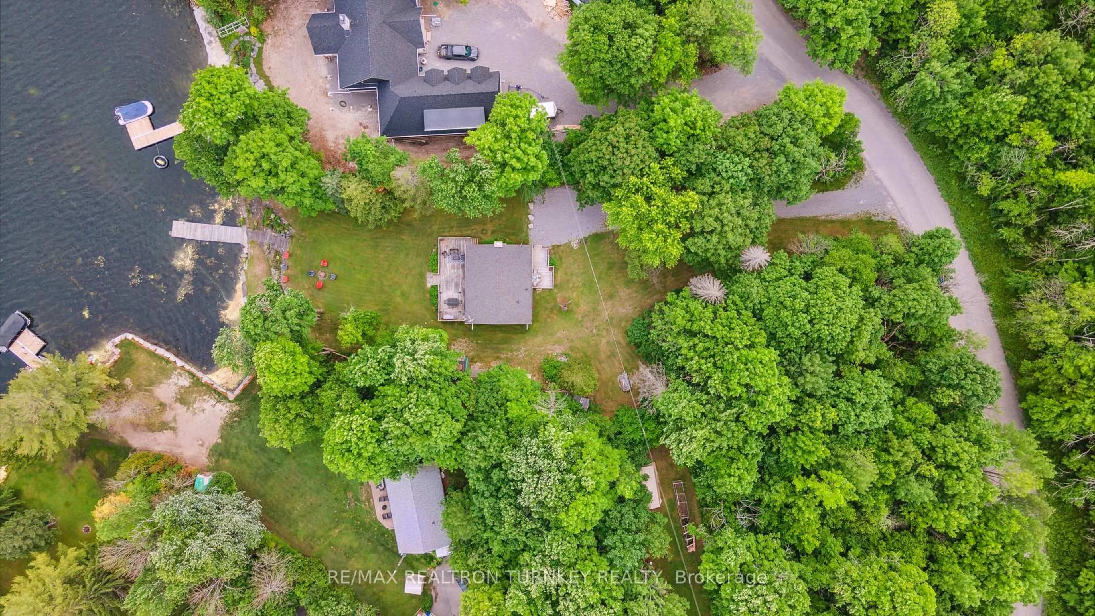 A pic from outside/outdoor area/front of a property/back of a property/a pic from drone, forest/trees view for 310 Northern Ave, Trent Lakes Ontario K0M 1A0
