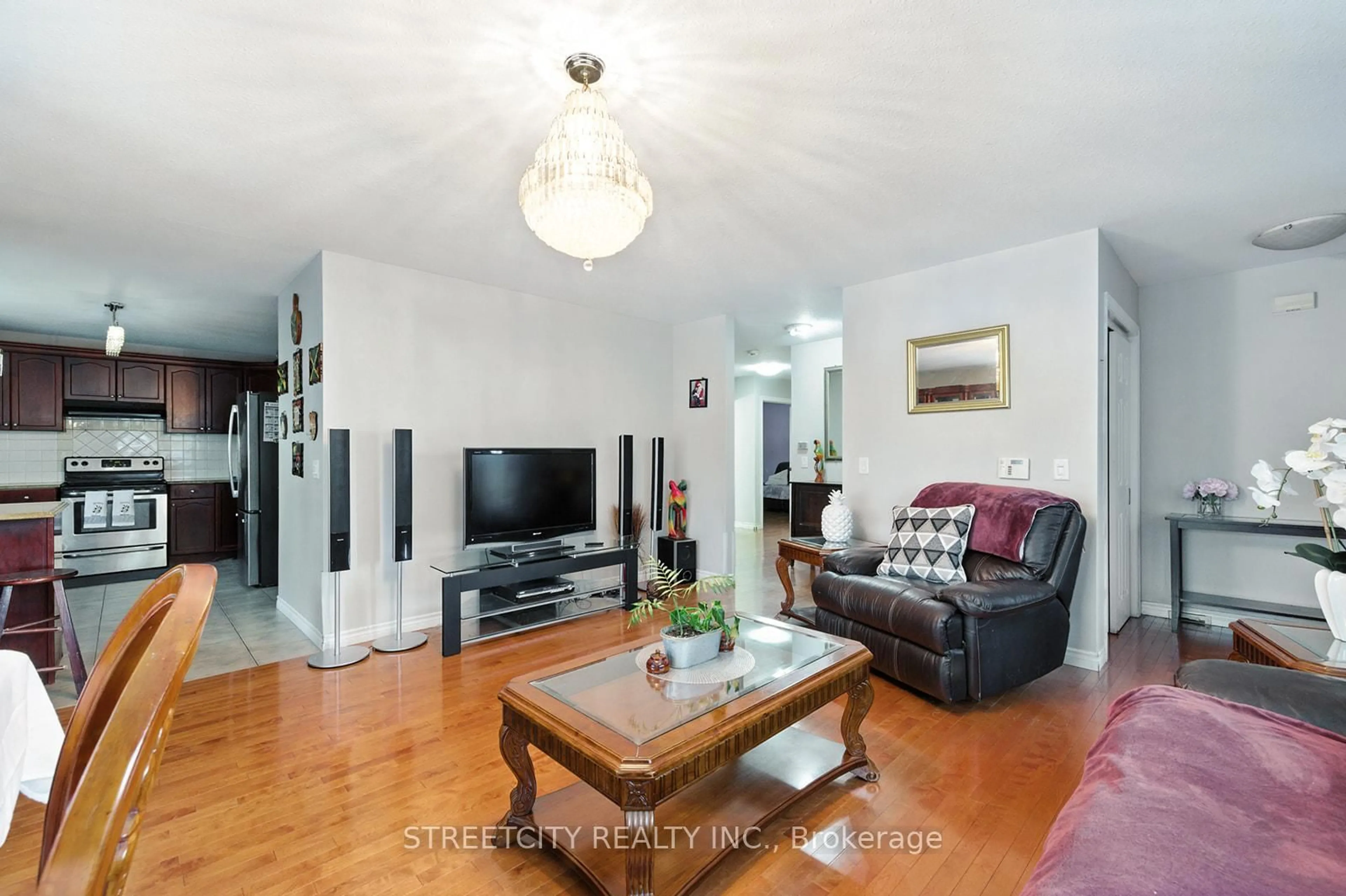 Living room with furniture, wood/laminate floor for 1673 Mcneil Rd, London South Ontario N6M 0A3