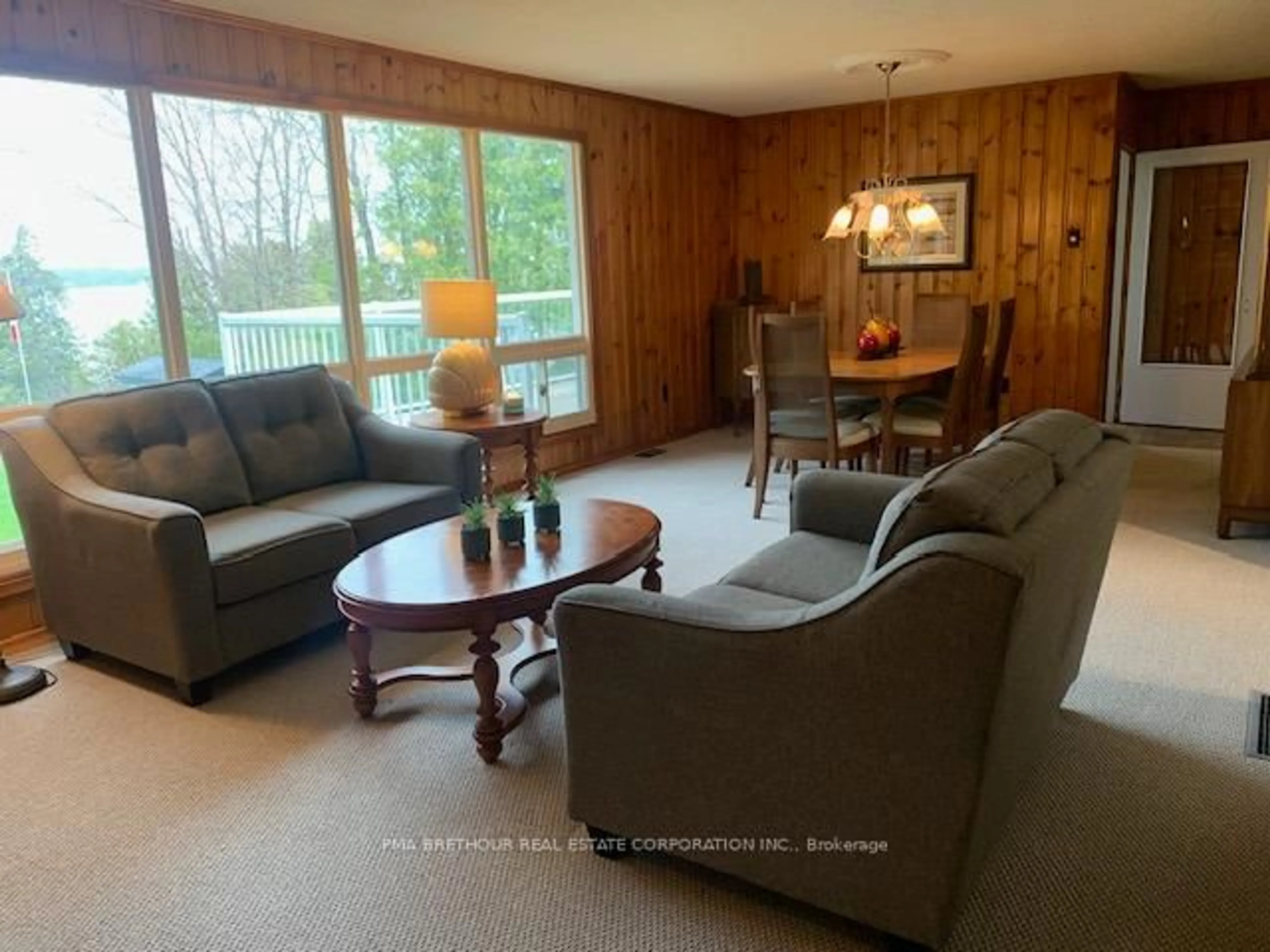 Living room with furniture, wood/laminate floor for 198 Pitts Cove Rd, Kawartha Lakes Ontario K0M 1L0