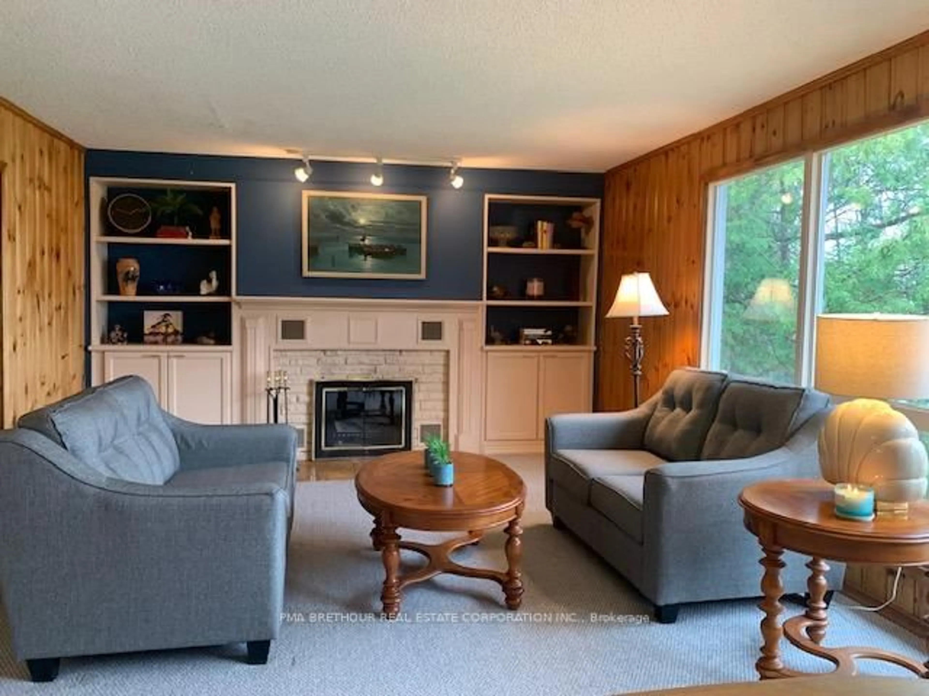 Living room with furniture, wood/laminate floor for 198 Pitts Cove Rd, Kawartha Lakes Ontario K0M 1L0