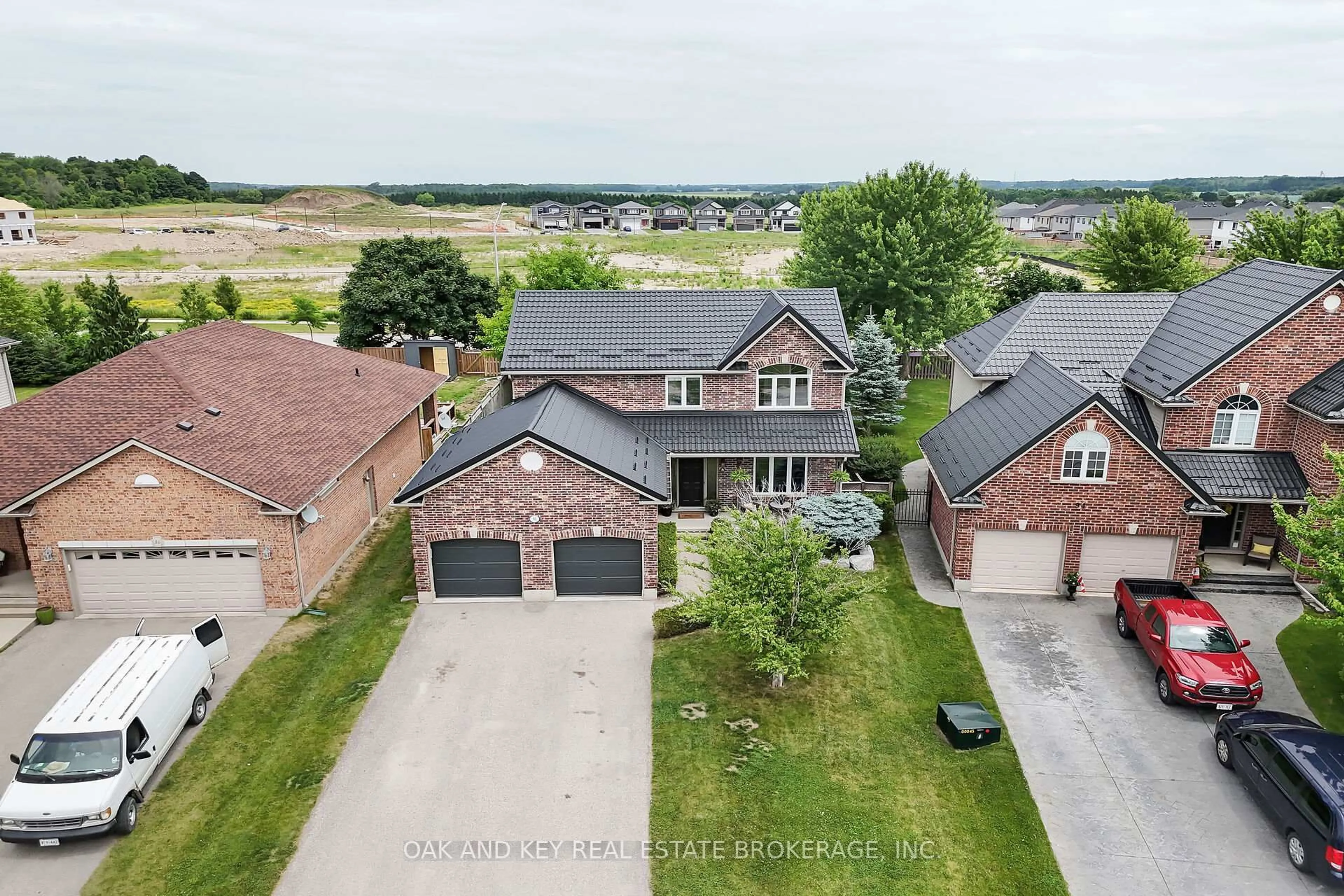 A pic from outside/outdoor area/front of a property/back of a property/a pic from drone, street for 90 Woodlily Lane, Middlesex Centre Ontario N0M 2A0