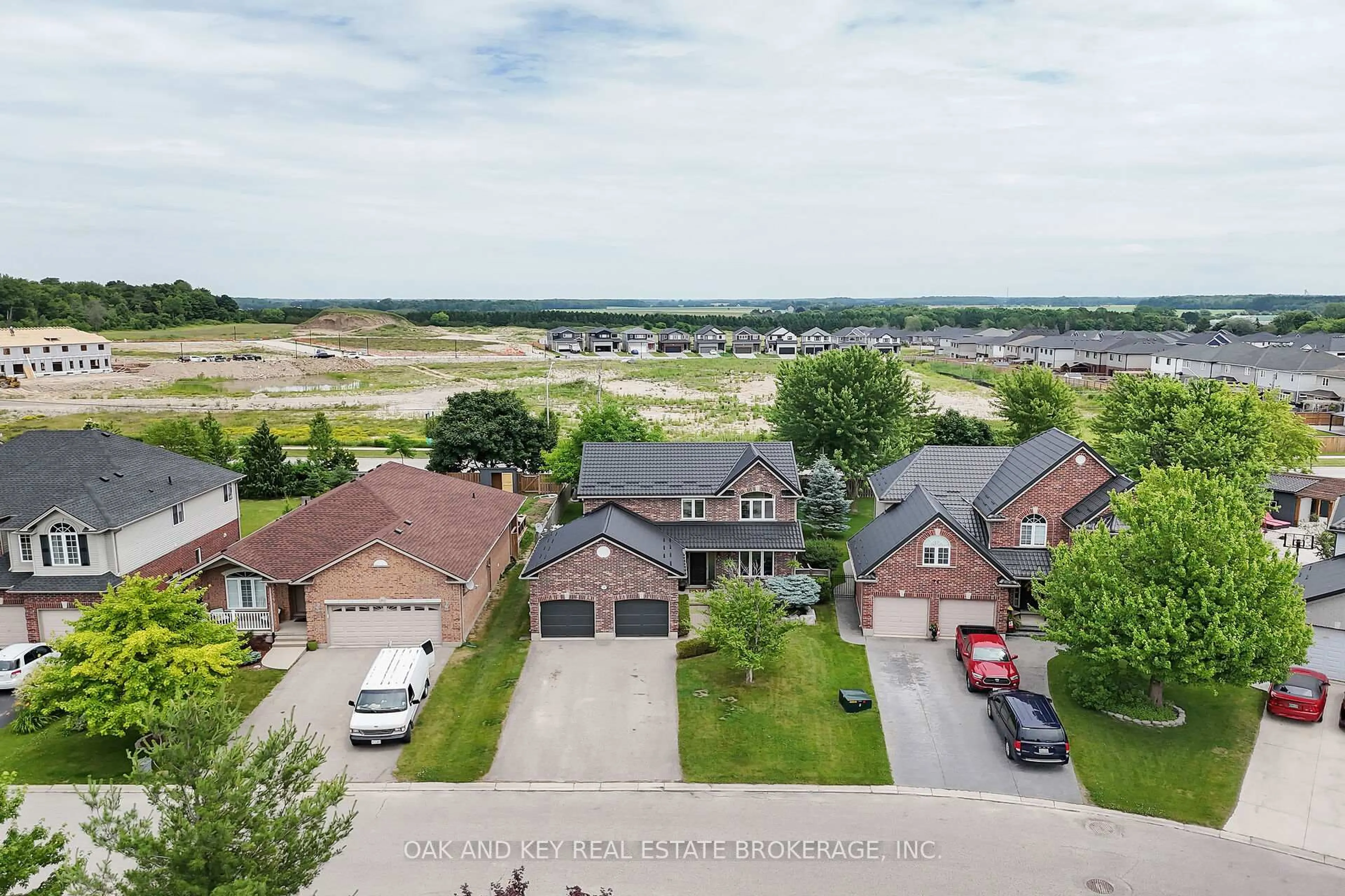 A pic from outside/outdoor area/front of a property/back of a property/a pic from drone, water/lake/river/ocean view for 90 Woodlily Lane, Middlesex Centre Ontario N0M 2A0
