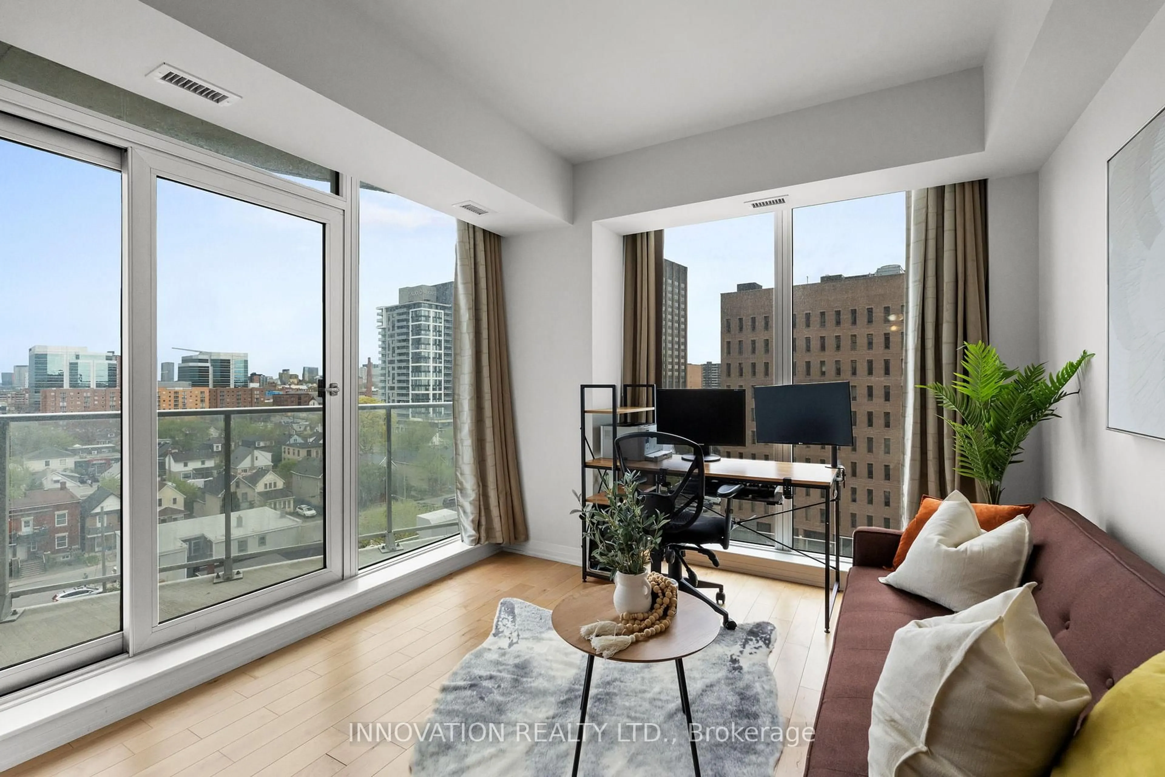 Living room with furniture, unknown for 805 Carling Ave #701, Ottawa Ontario K1S 5W9