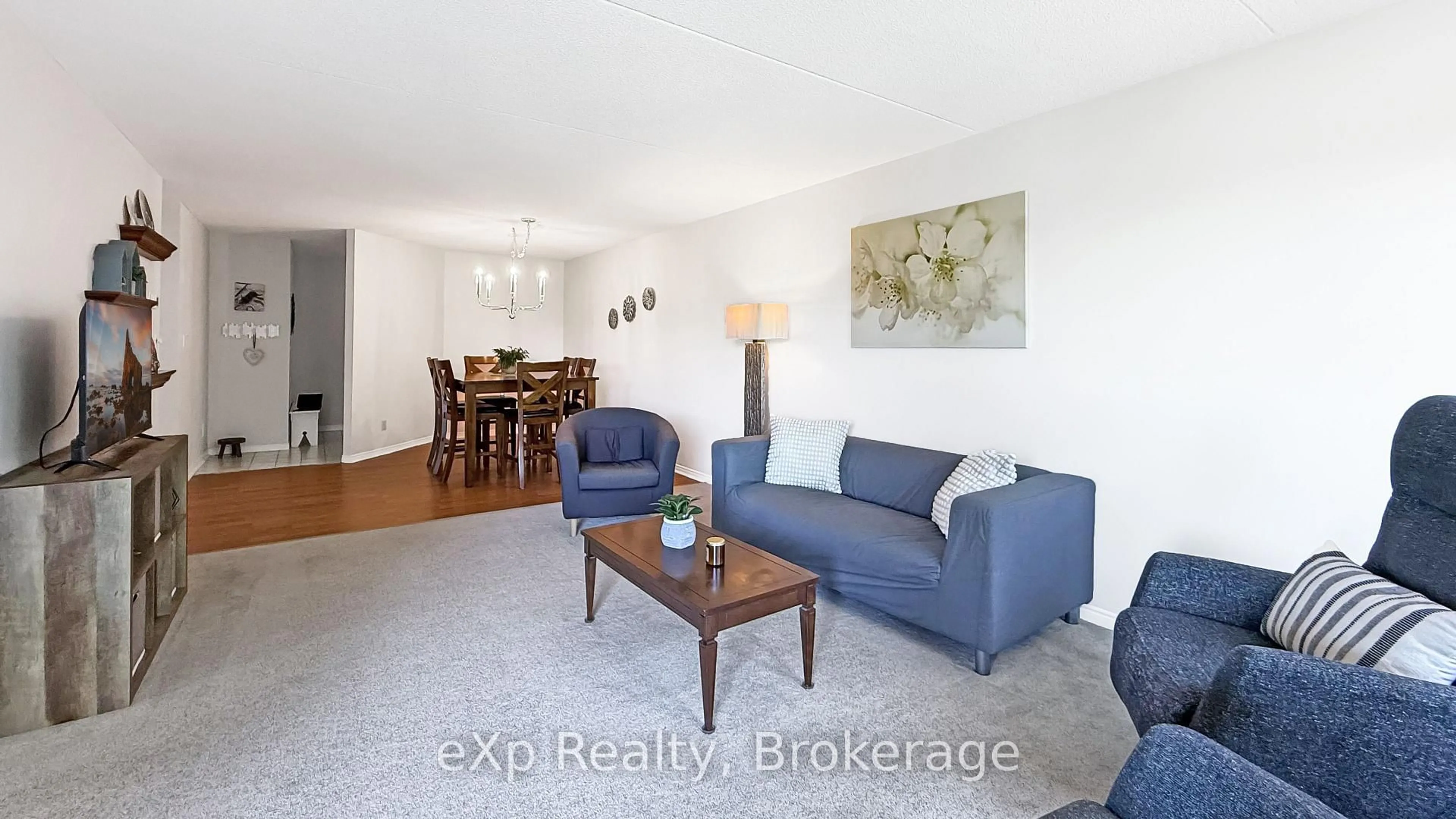 Living room with furniture, wood/laminate floor for 536 11th Ave #404, Hanover Ontario N4N 2S4