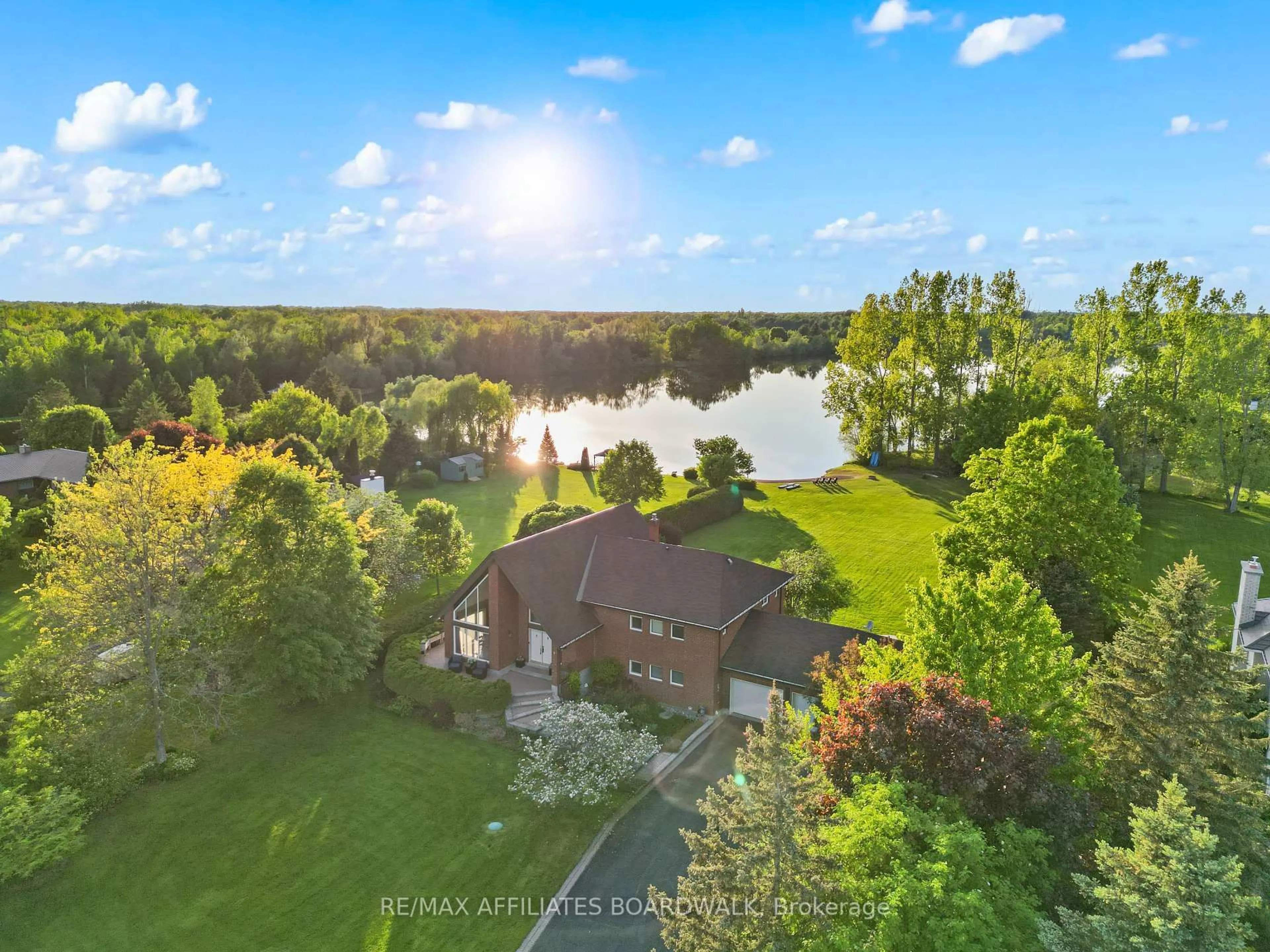 A pic from outside/outdoor area/front of a property/back of a property/a pic from drone, water/lake/river/ocean view for 1700 Lakeshore Dr, Greely Ontario K4P 1H1