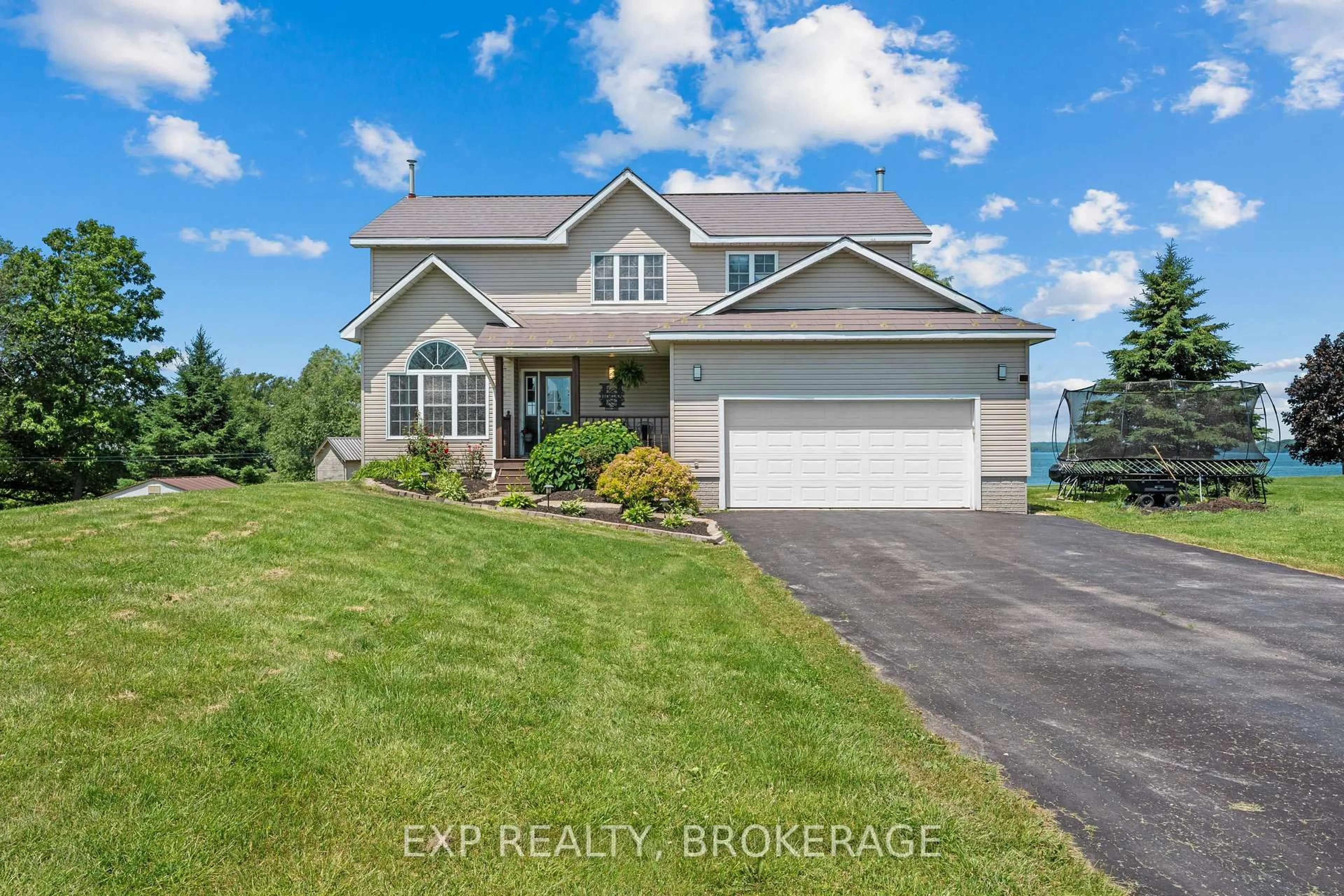 A pic from outside/outdoor area/front of a property/back of a property/a pic from drone, water/lake/river/ocean view for 26 BOXEN HARBOUR Lane, Wolfe Island Ontario K0H 2Y0