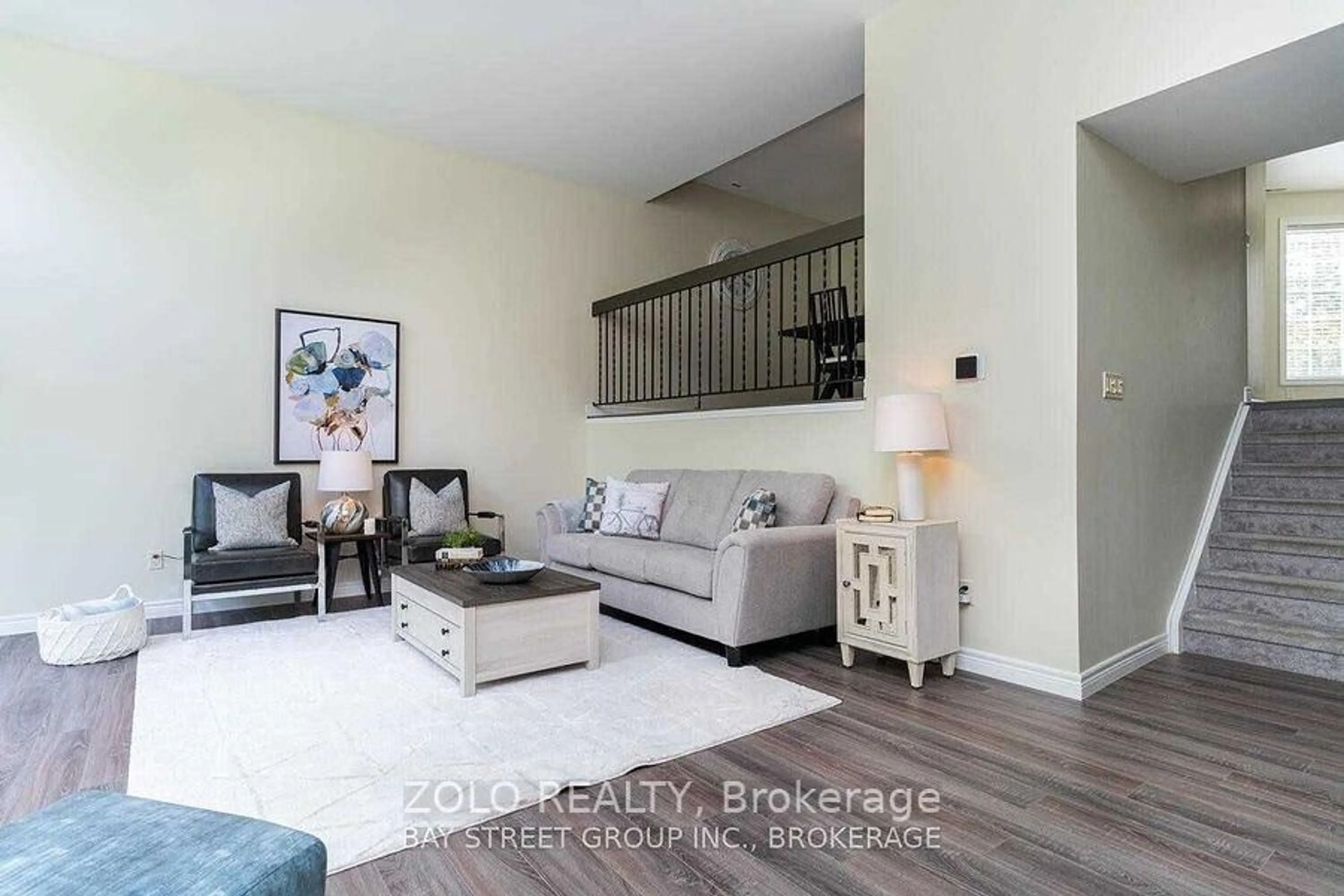 Living room with furniture, wood/laminate floor for 703 Windermere Rd #21, London North Ontario N5X 2P1