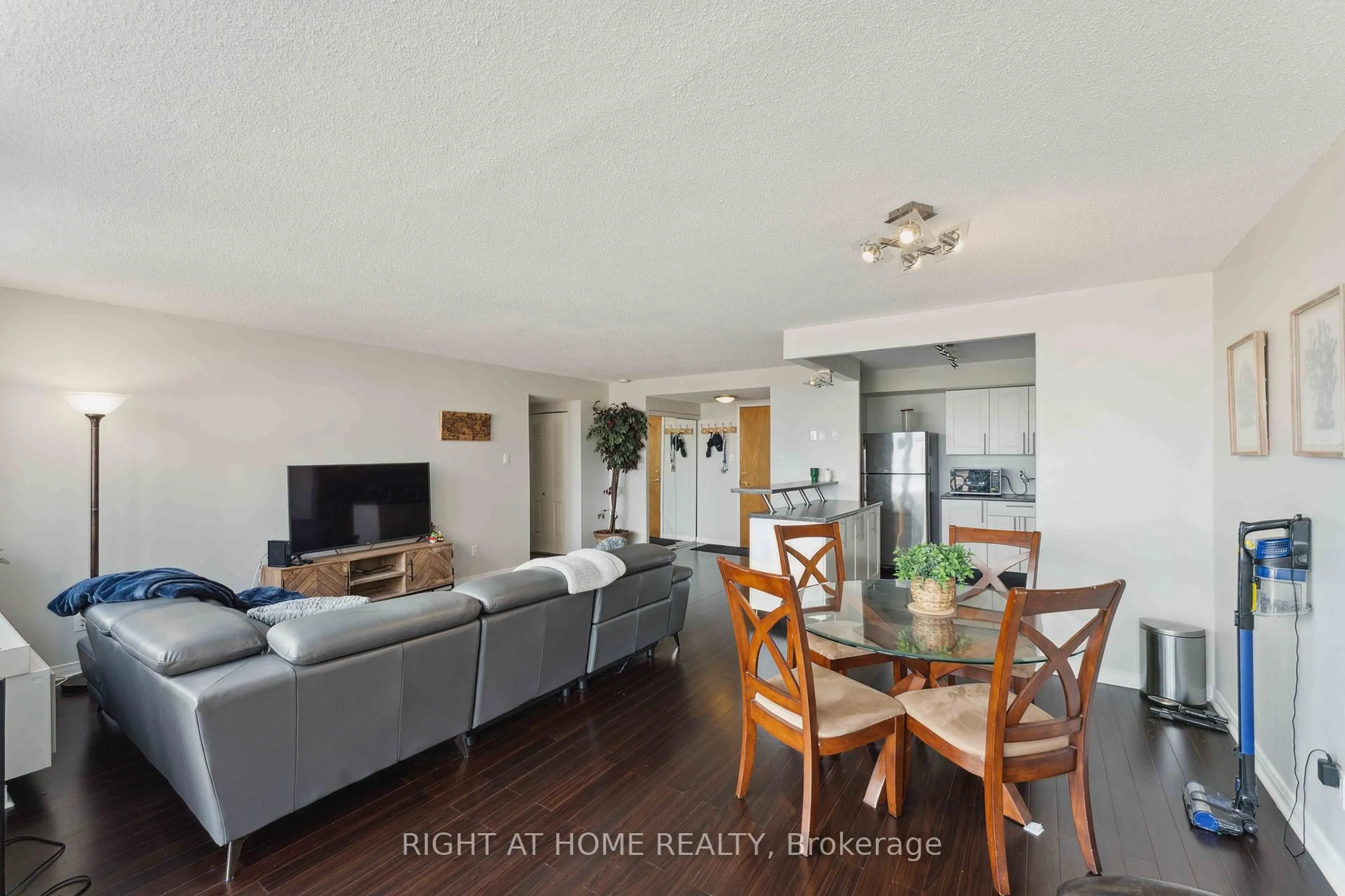 Living room with furniture, wood/laminate floor for 2760 CAROUSEL Cres #502, Ottawa Ontario K1T 2N4