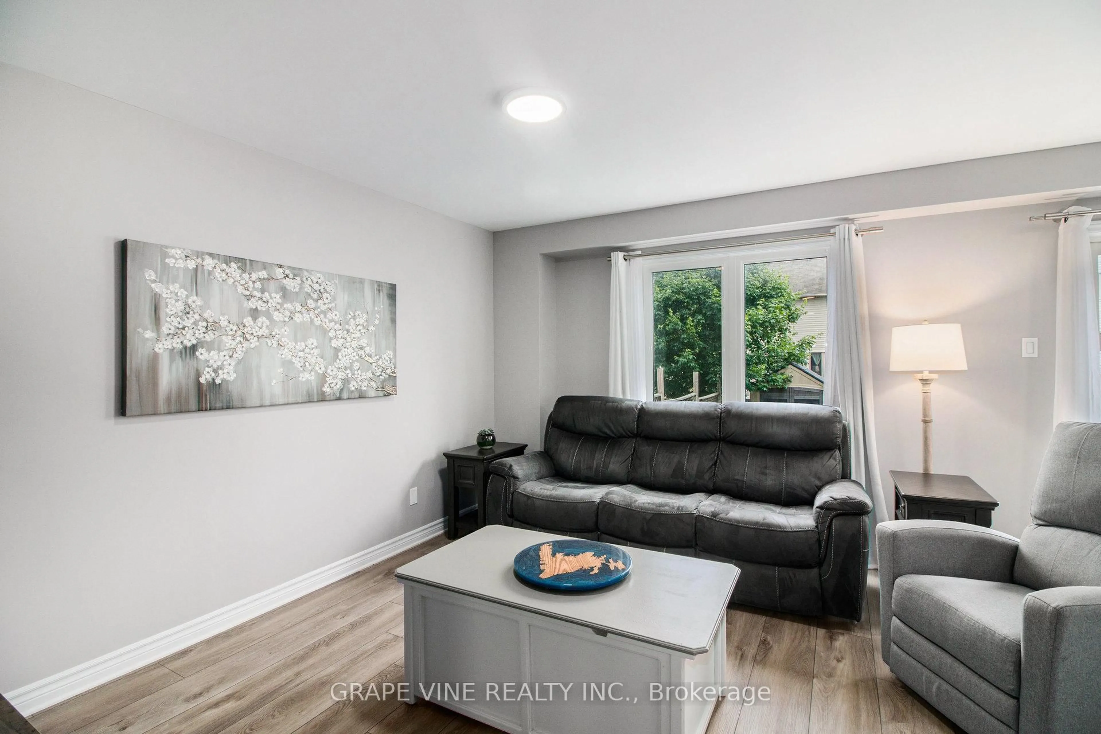 Living room with furniture, wood/laminate floor for 117 Asselin St, The Nation Ontario K0A 2M0
