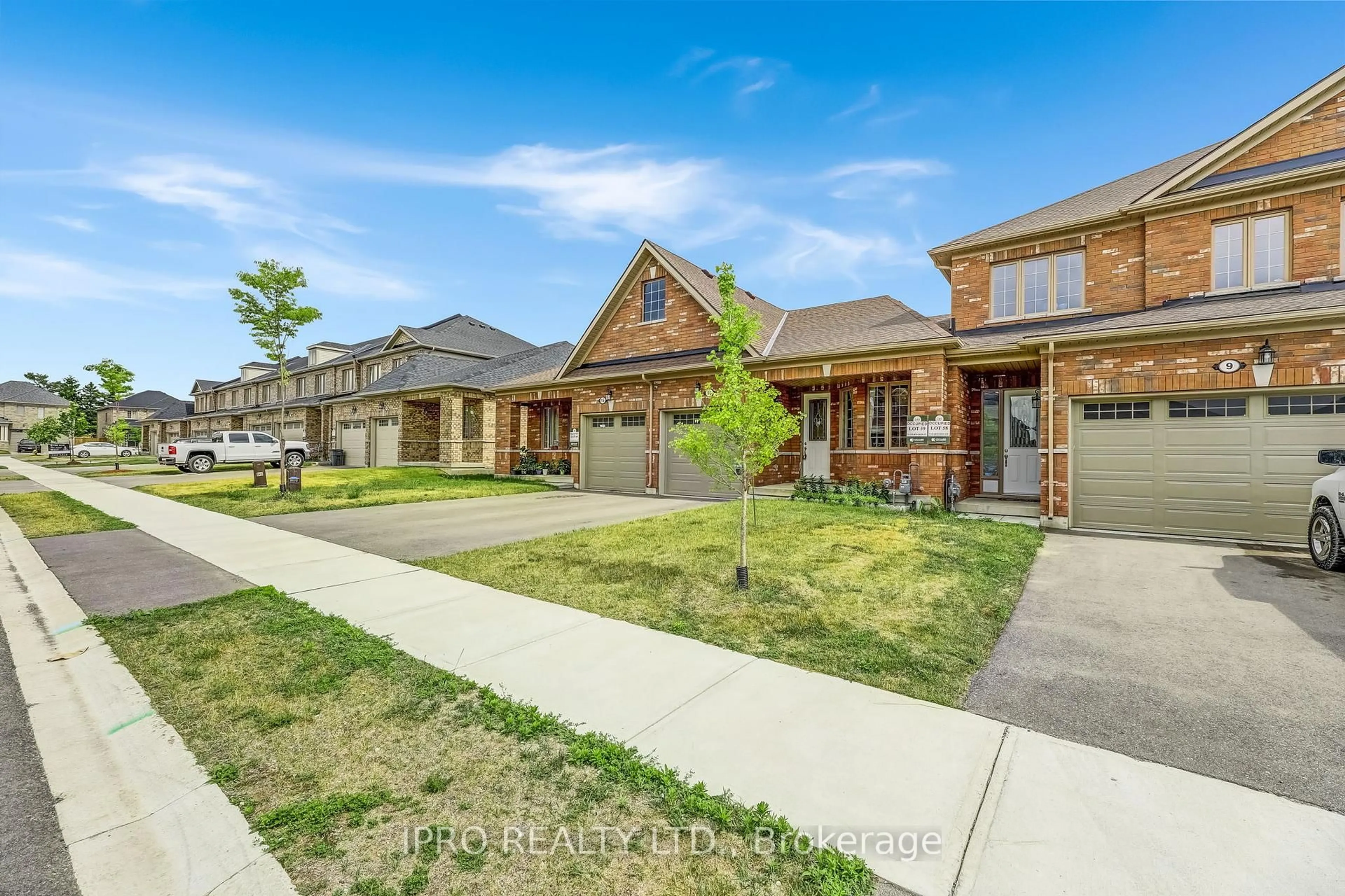 Home with brick exterior material, street for 11 Harwood St, Tillsonburg Ontario N4G 0J7