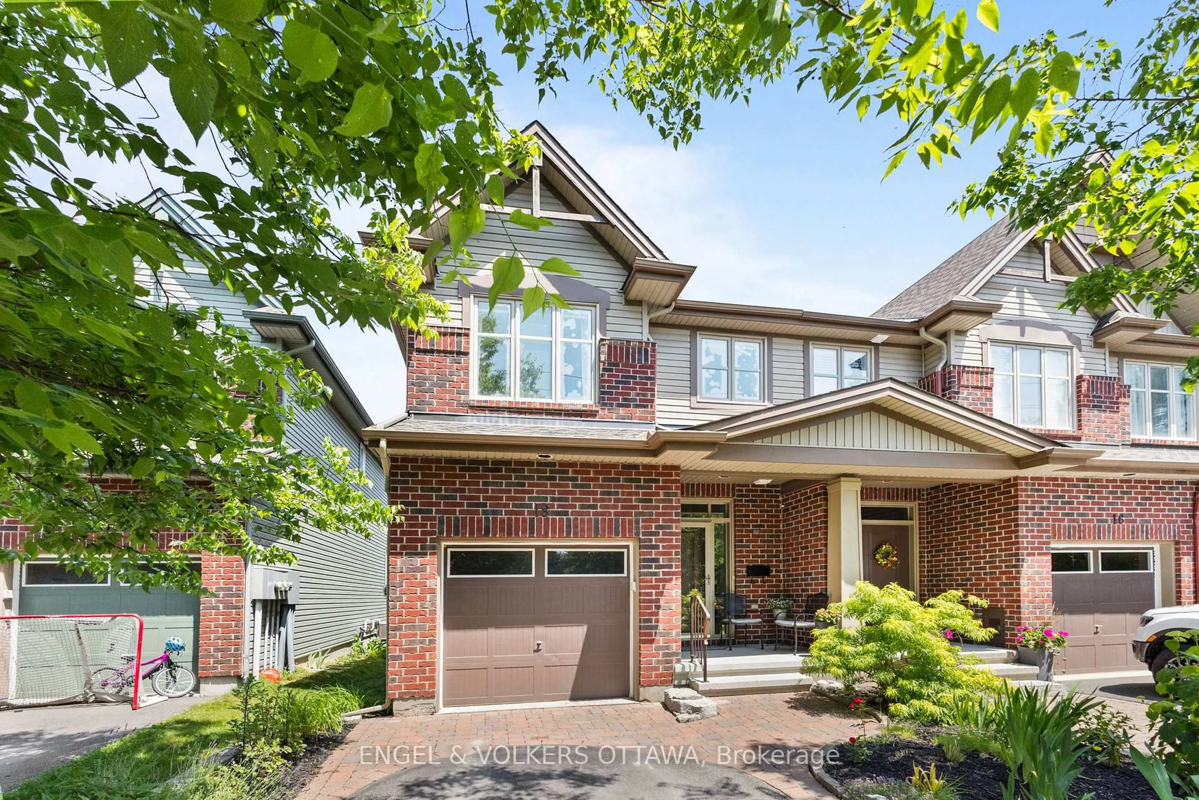 Home with brick exterior material, street for 18 McCooeye Lane, Ottawa Ontario K2S 1B9