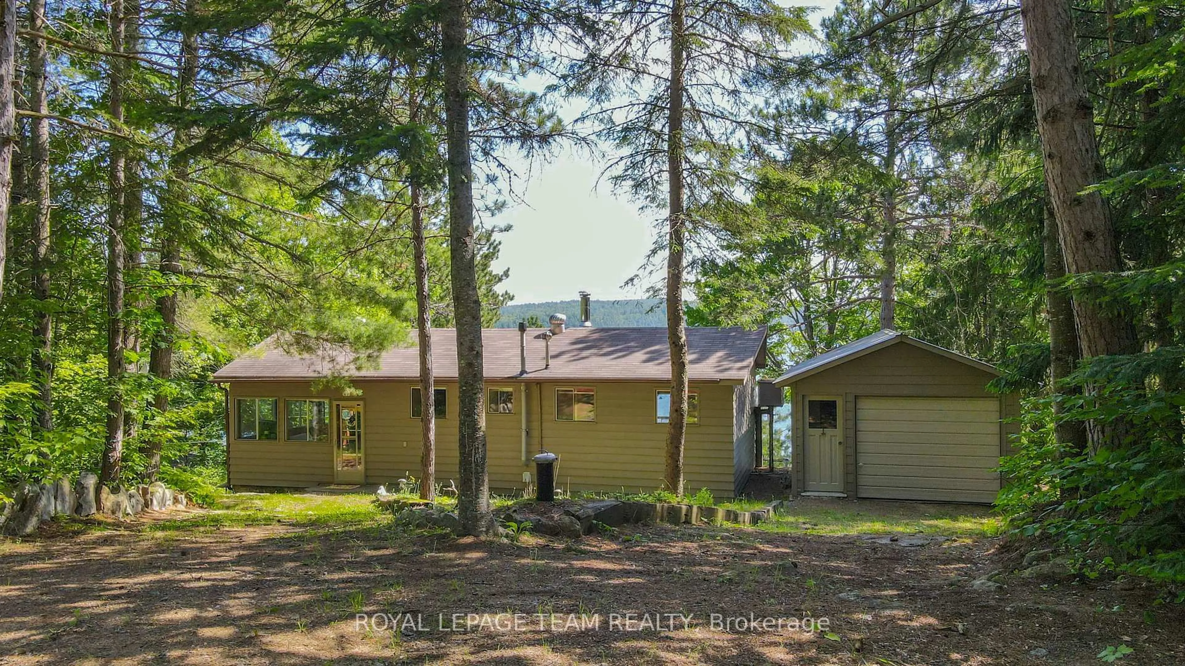 A pic from outside/outdoor area/front of a property/back of a property/a pic from drone, forest/trees view for 1048 Gaffney Rd, South Algonquin Ontario K0J 2C0