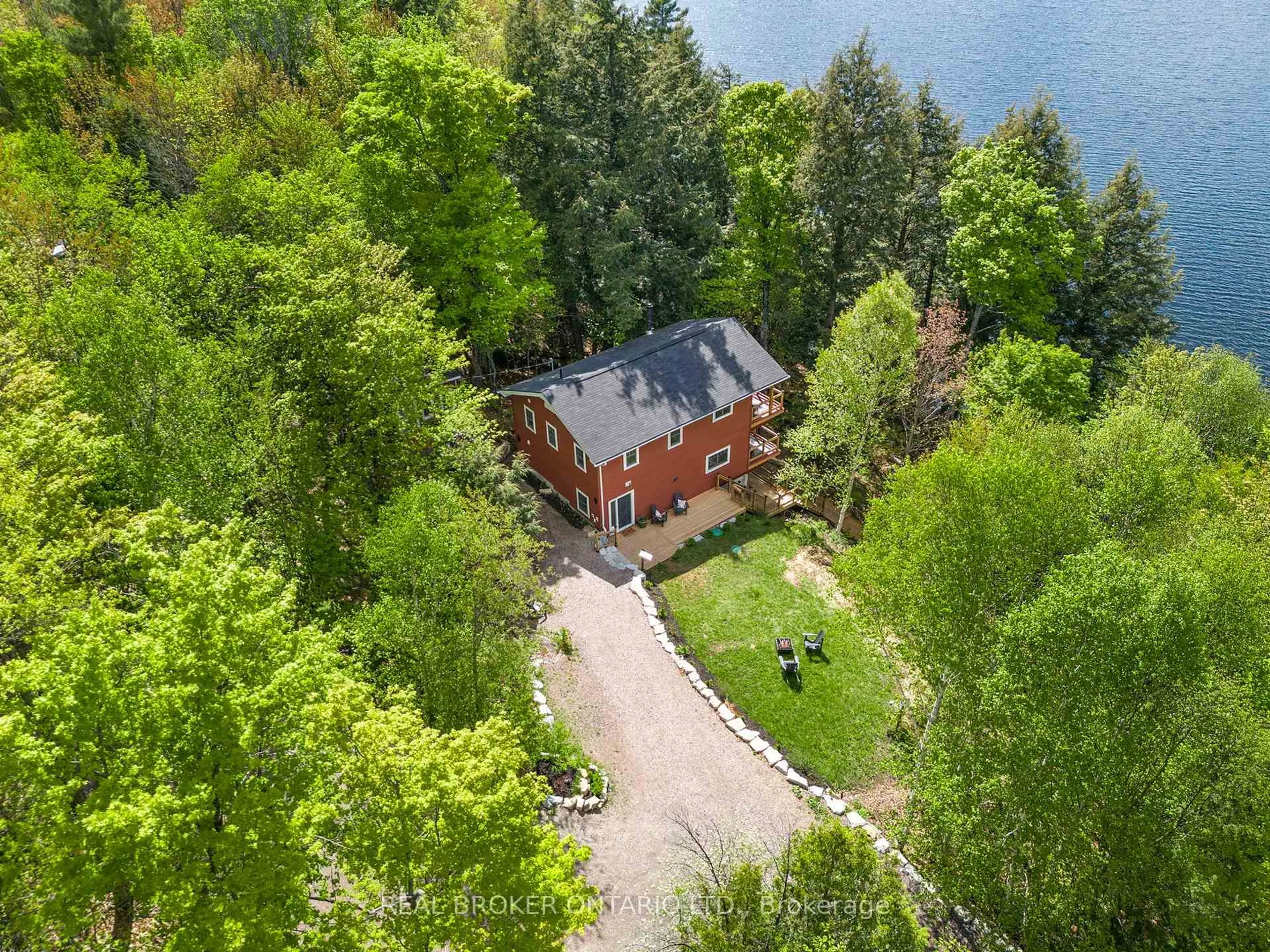 A pic from outside/outdoor area/front of a property/back of a property/a pic from drone, water/lake/river/ocean view for 25 ASH Lane, Magnetawan Ontario P0A 1P0