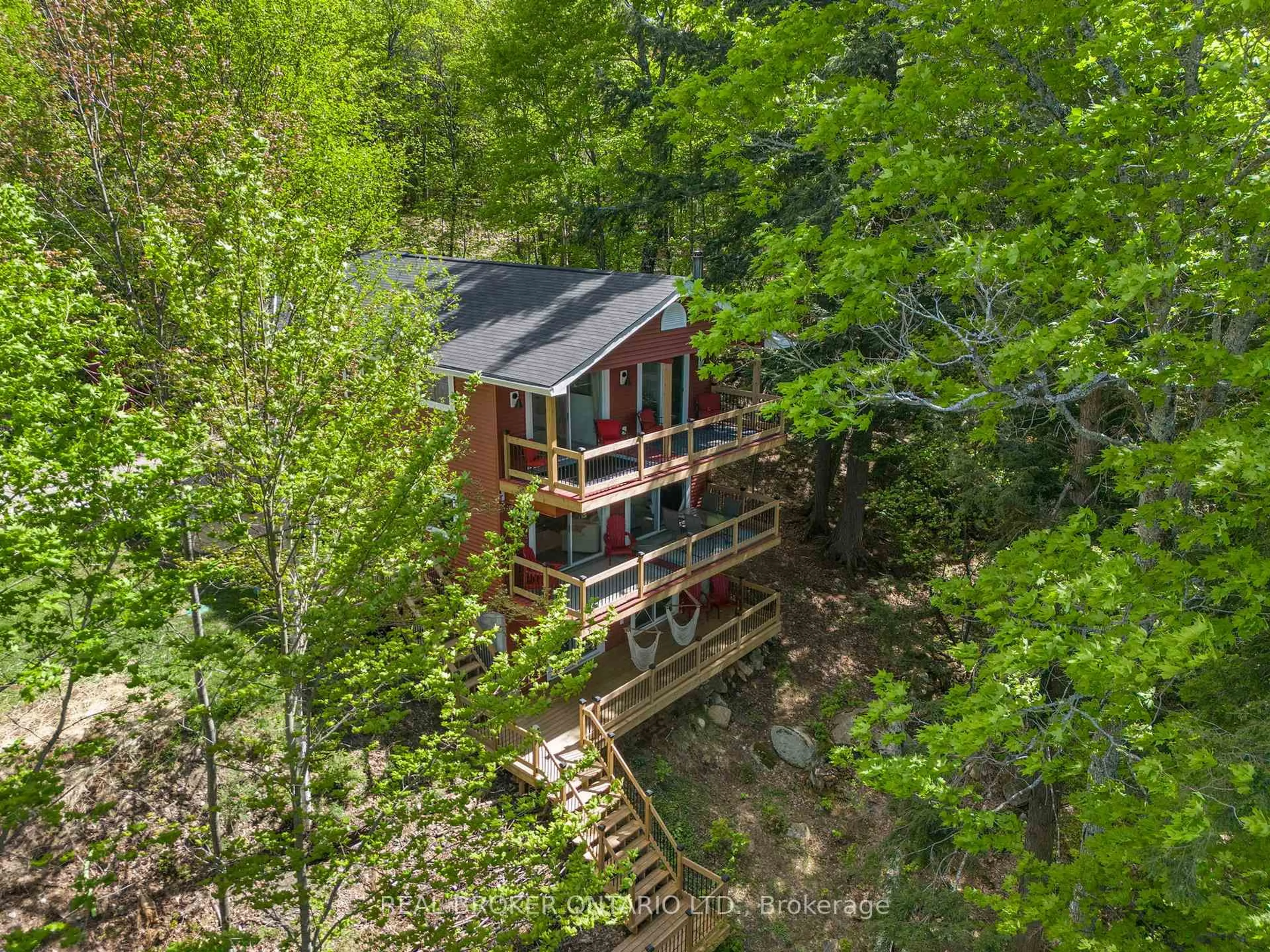 A pic from outside/outdoor area/front of a property/back of a property/a pic from drone, forest/trees view for 25 ASH Lane, Magnetawan Ontario P0A 1P0