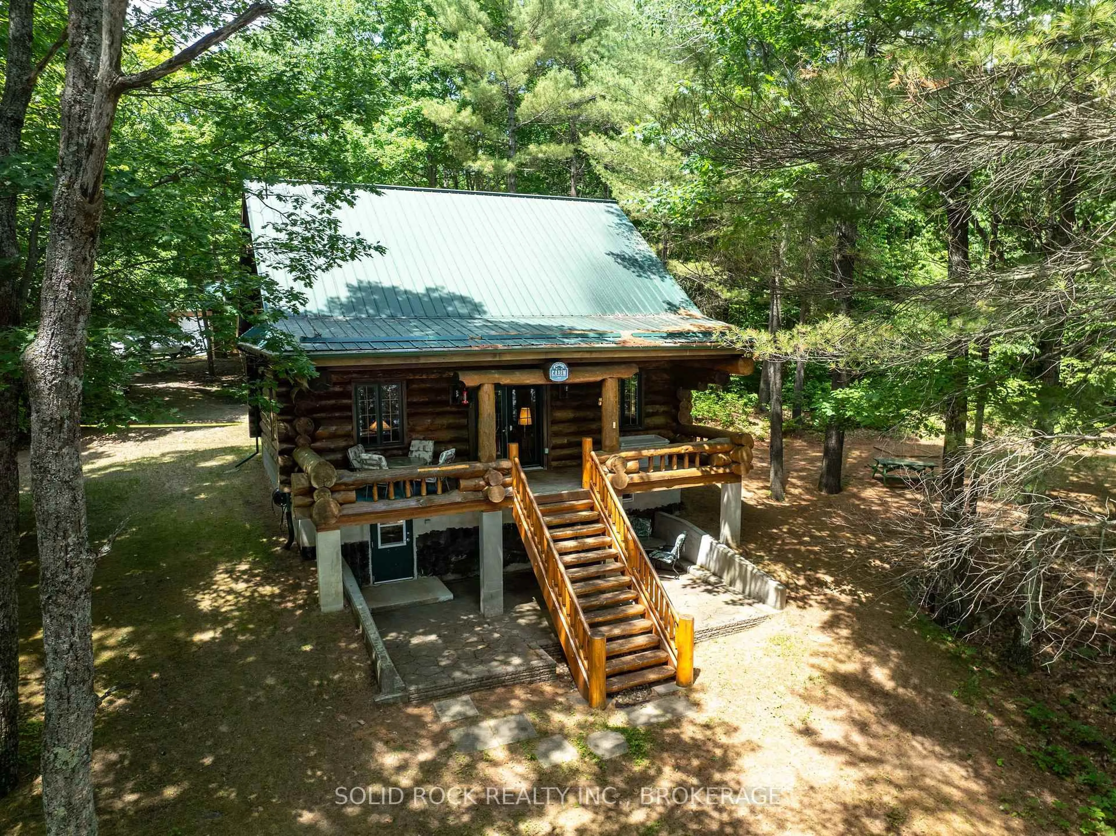 A pic from outside/outdoor area/front of a property/back of a property/a pic from drone, water/lake/river/ocean view for 2091 Gull Lake Estates Lane, Arden Ontario K0H 1B0