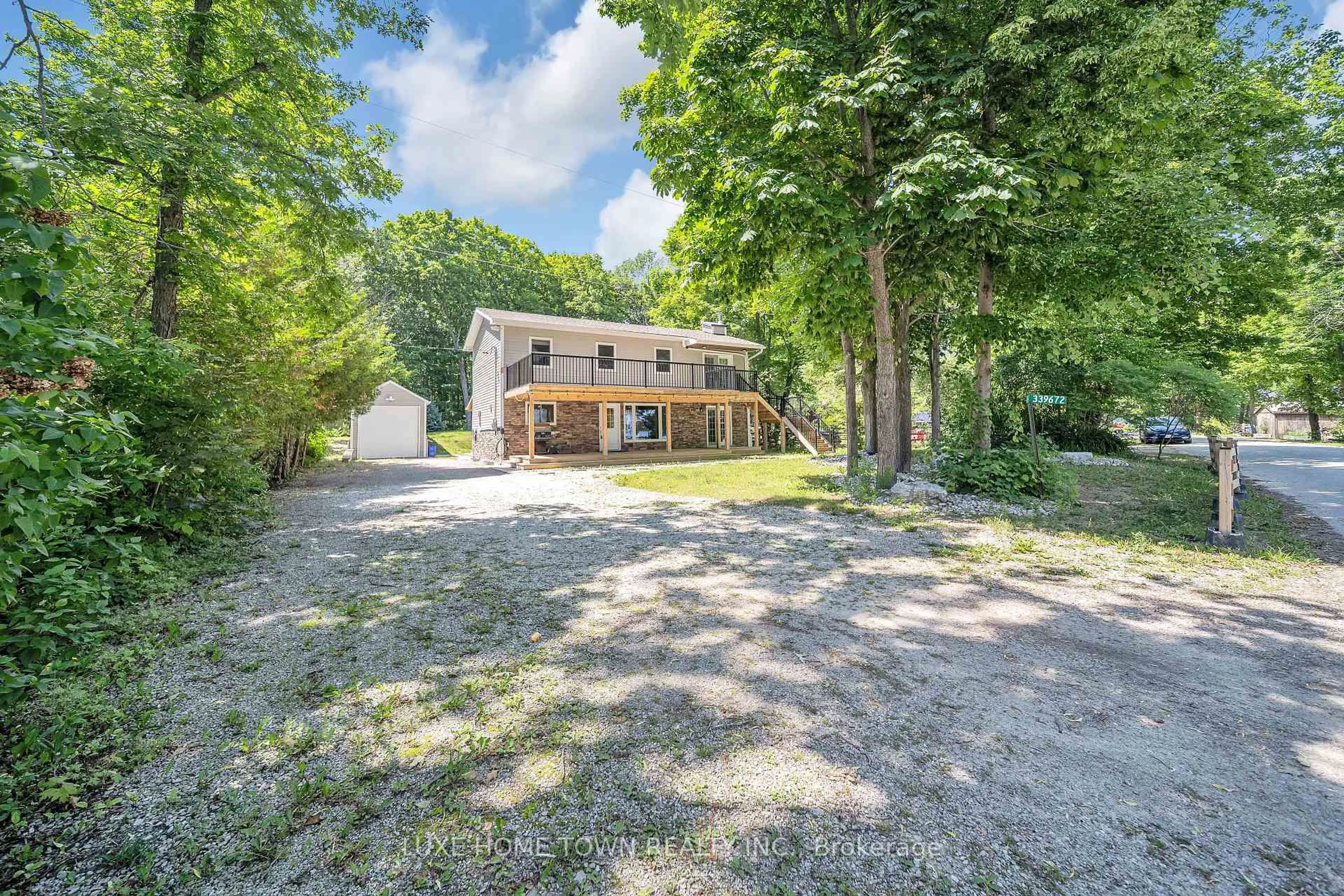 A pic from outside/outdoor area/front of a property/back of a property/a pic from drone, street for 339672 Presquile Rd, Georgian Bluffs Ontario N0H 1S0