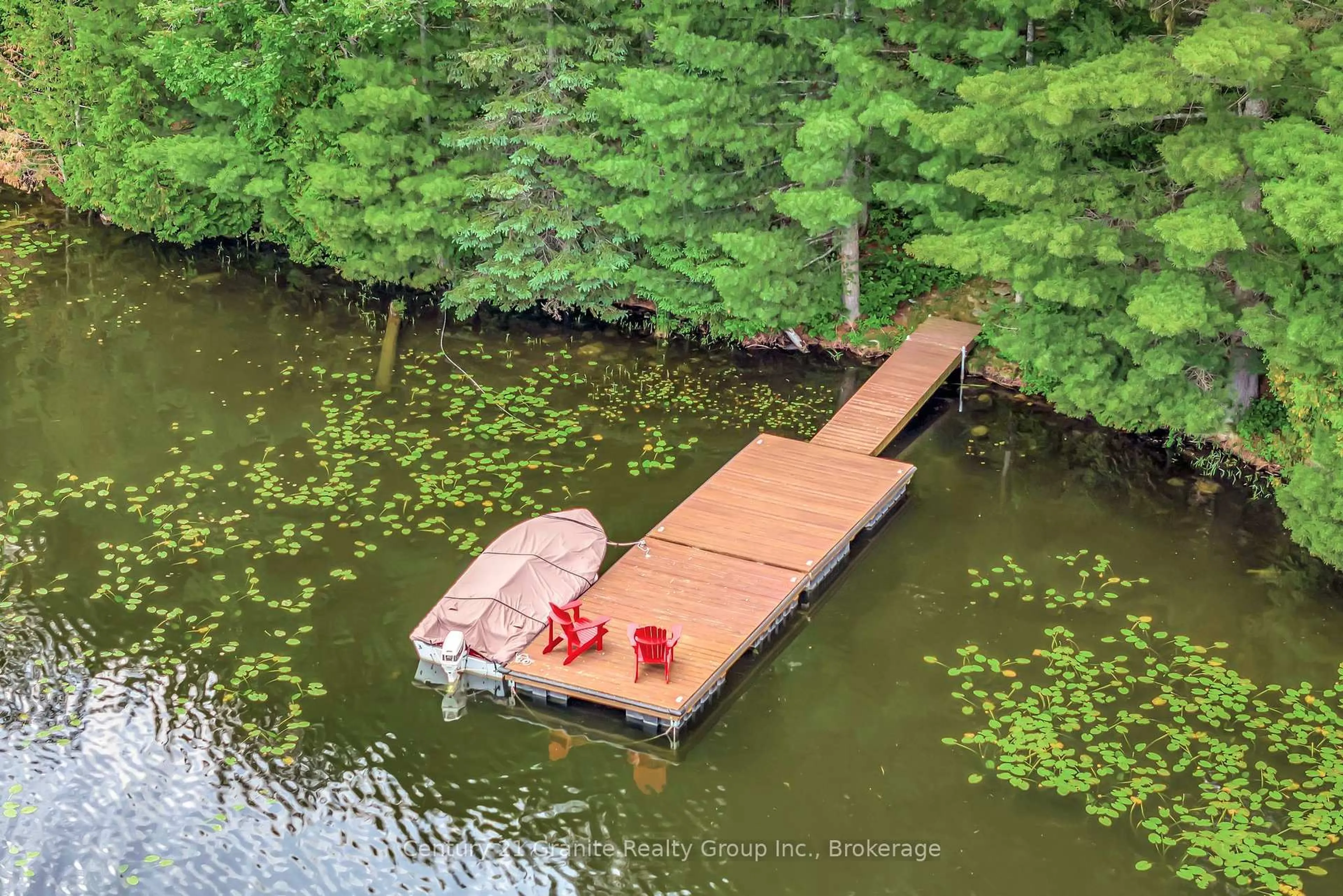 A pic from outside/outdoor area/front of a property/back of a property/a pic from drone, water/lake/river/ocean view for 1031 Rotunda Dr, Highlands East Ontario K0M 1R0