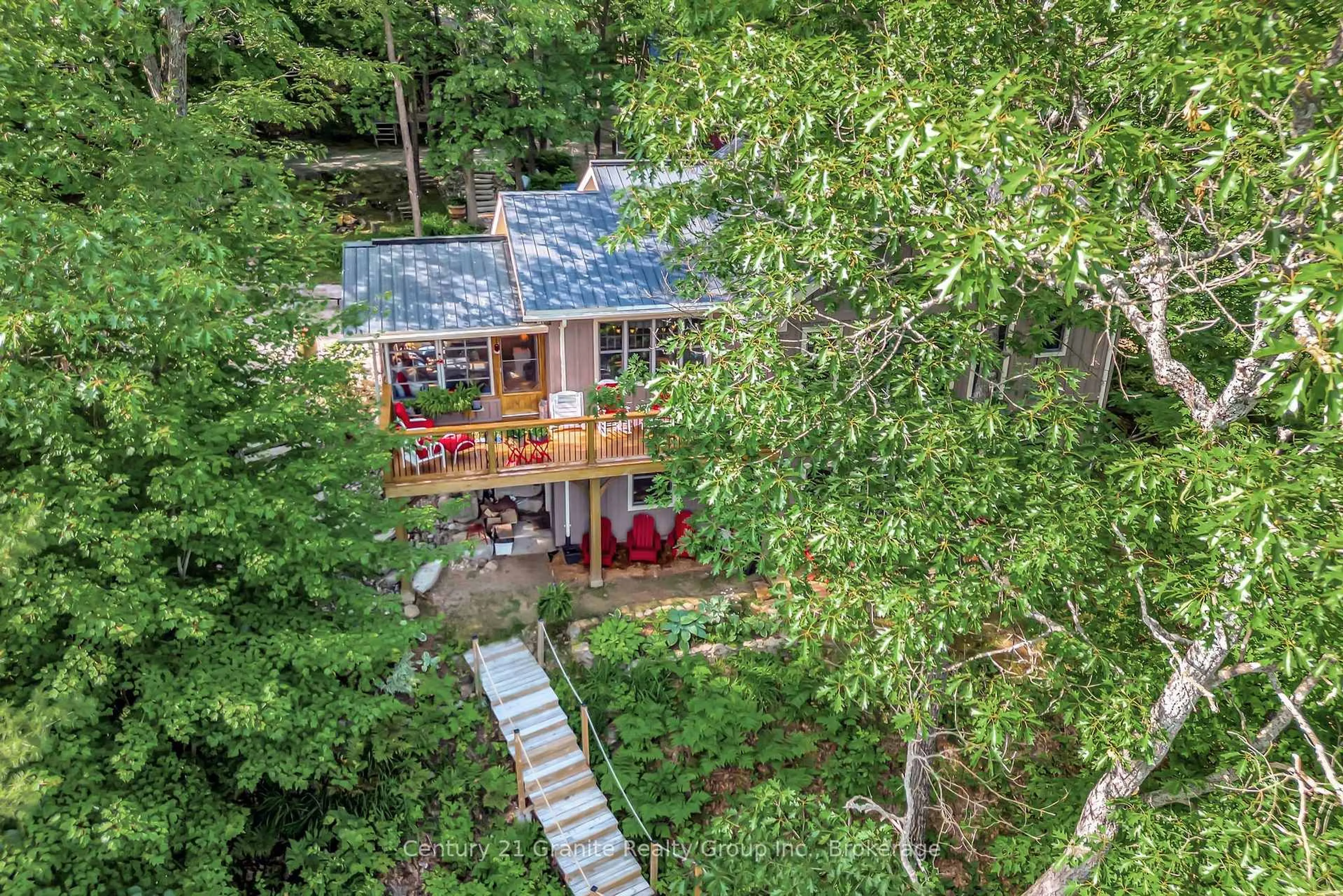 A pic from outside/outdoor area/front of a property/back of a property/a pic from drone, forest/trees view for 1031 Rotunda Dr, Highlands East Ontario K0M 1R0