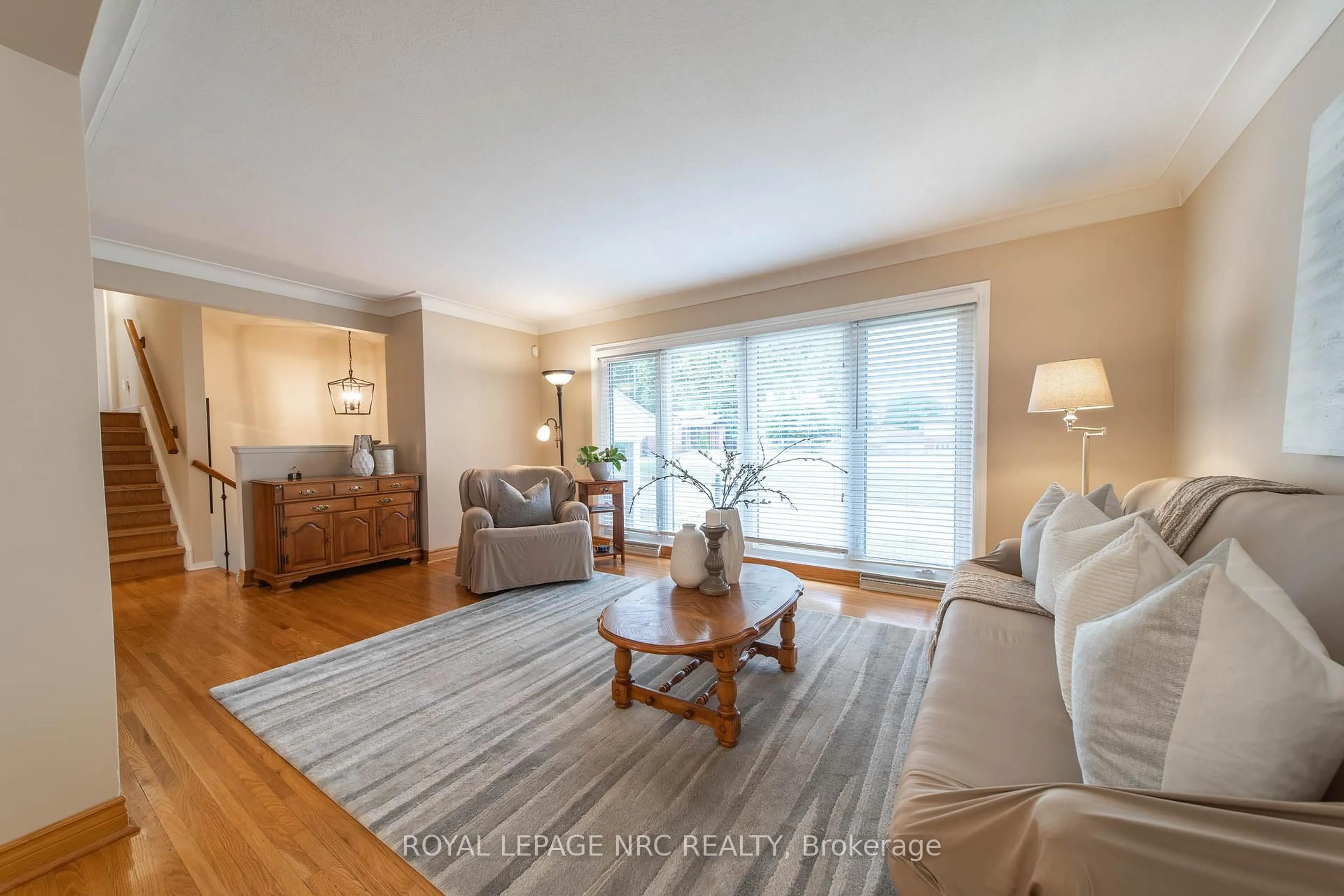 Living room with furniture, wood/laminate floor for 6246 Glengate St, Niagara Falls Ontario L2E 5S3
