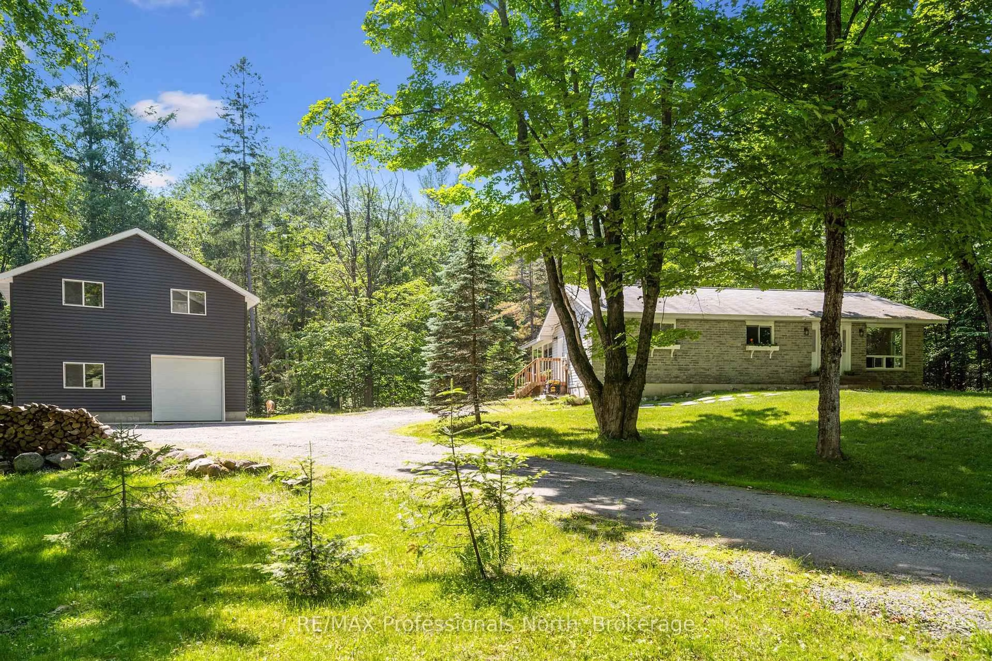 A pic from outside/outdoor area/front of a property/back of a property/a pic from drone, forest/trees view for 504 South Waseosa Lake Rd, Huntsville Ontario P1H 2N5