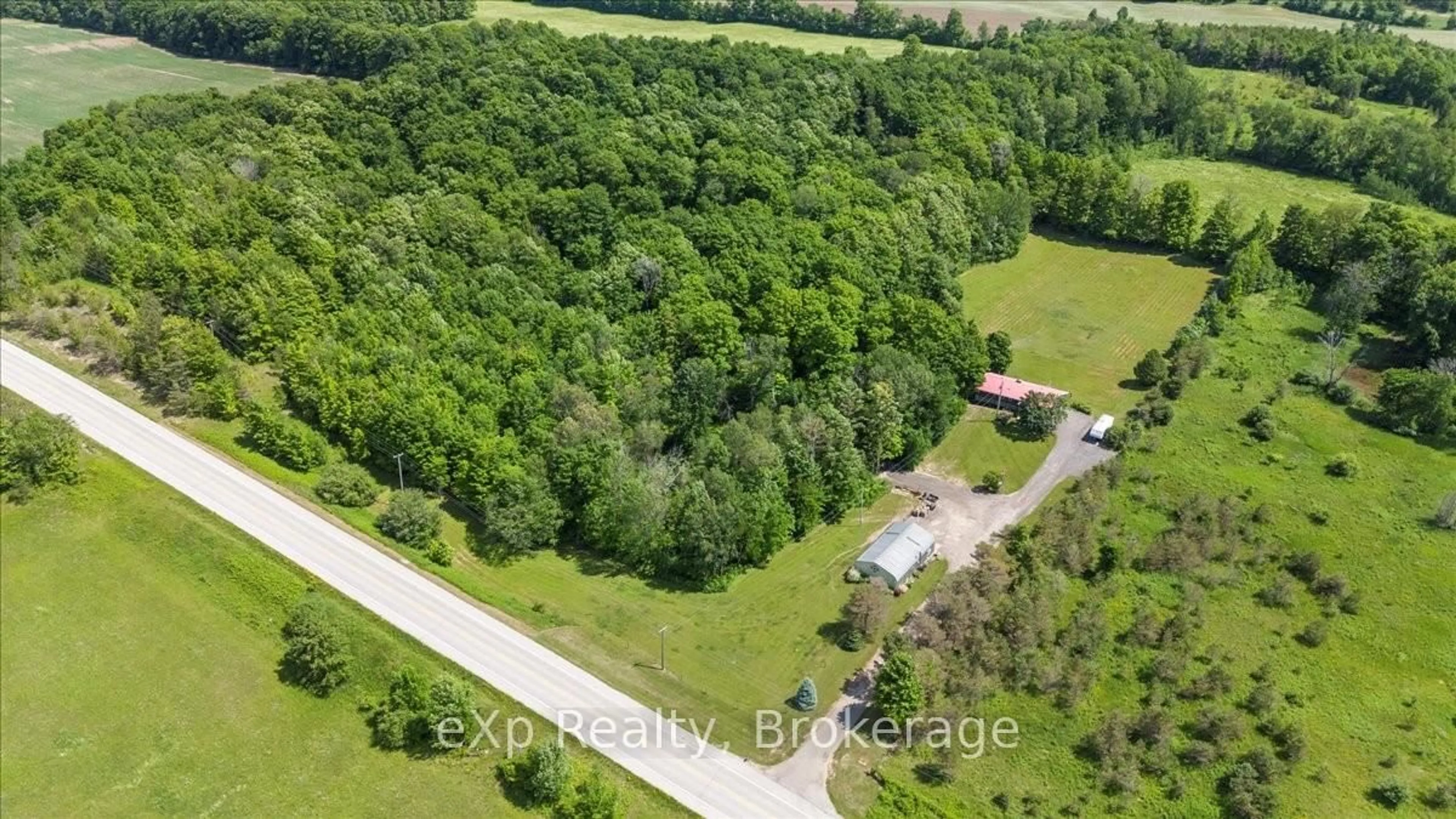 A pic from outside/outdoor area/front of a property/back of a property/a pic from drone, forest/trees view for 122668 Grey Road 9, West Grey Ontario N0G 1C0