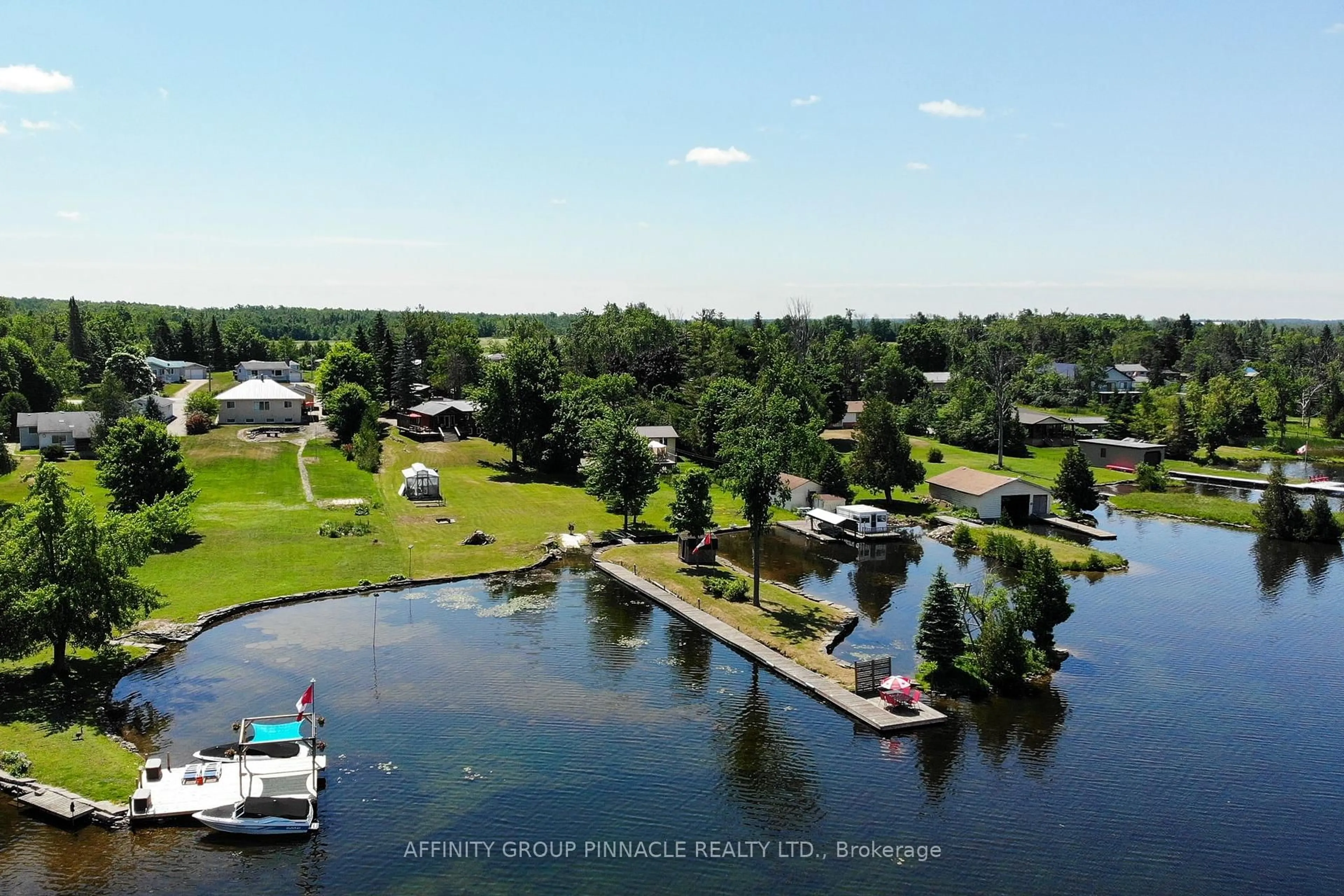 A pic from outside/outdoor area/front of a property/back of a property/a pic from drone, water/lake/river/ocean view for 63 Robinson Ave, Kawartha Lakes Ontario K0M 2B0