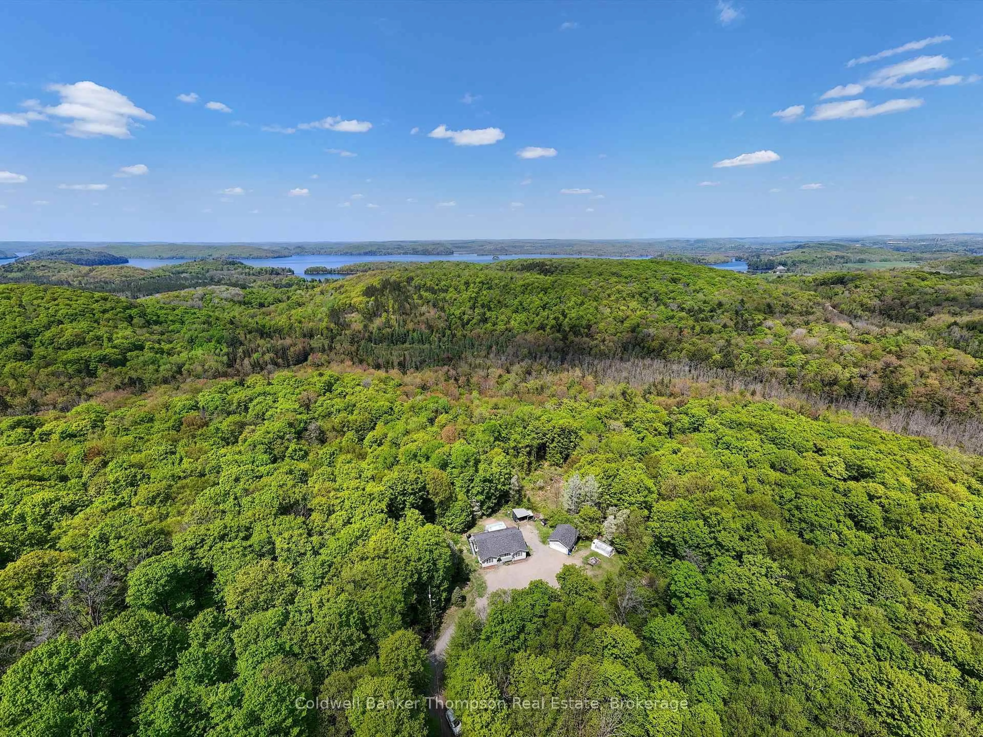 A pic from outside/outdoor area/front of a property/back of a property/a pic from drone, water/lake/river/ocean view for 260 Madill Church Rd, Huntsville Ontario P1H 0G8
