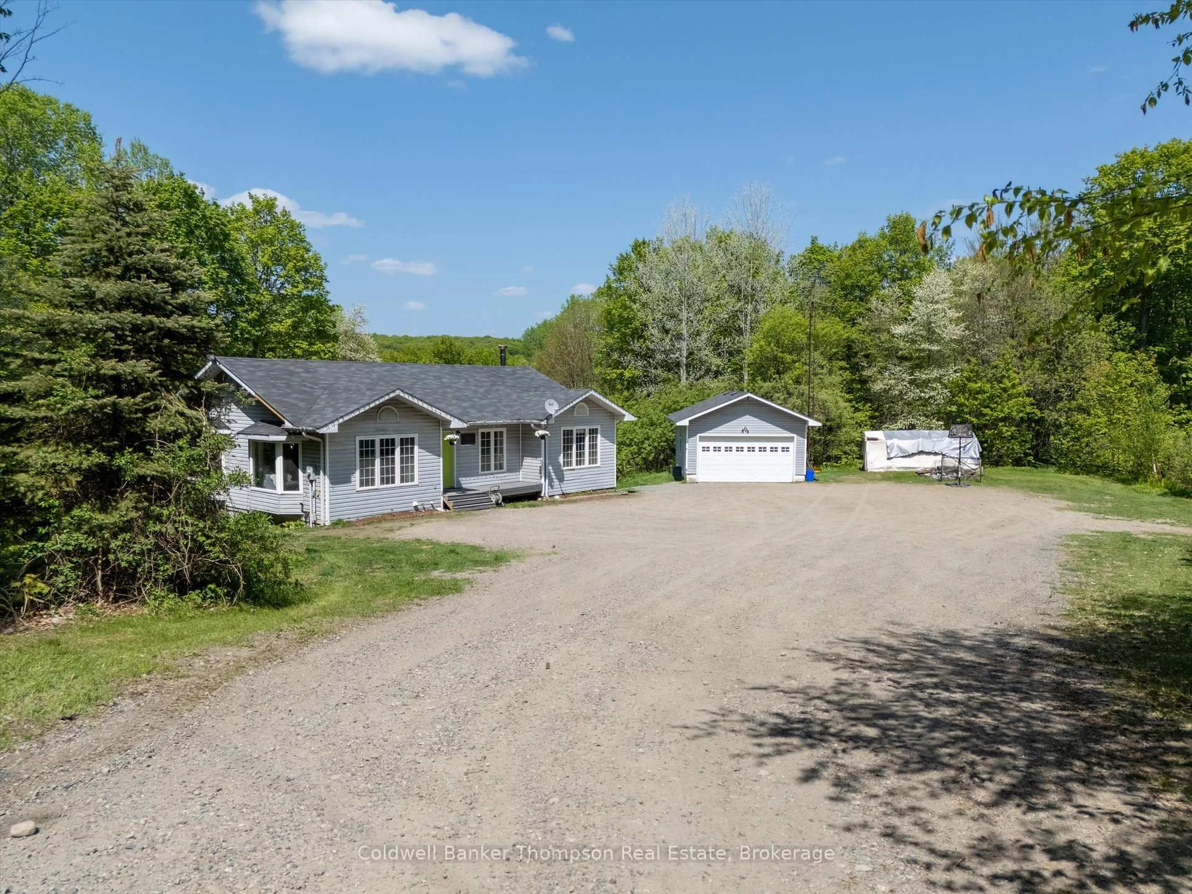 A pic from outside/outdoor area/front of a property/back of a property/a pic from drone, street for 260 Madill Church Rd, Huntsville Ontario P1H 0G8