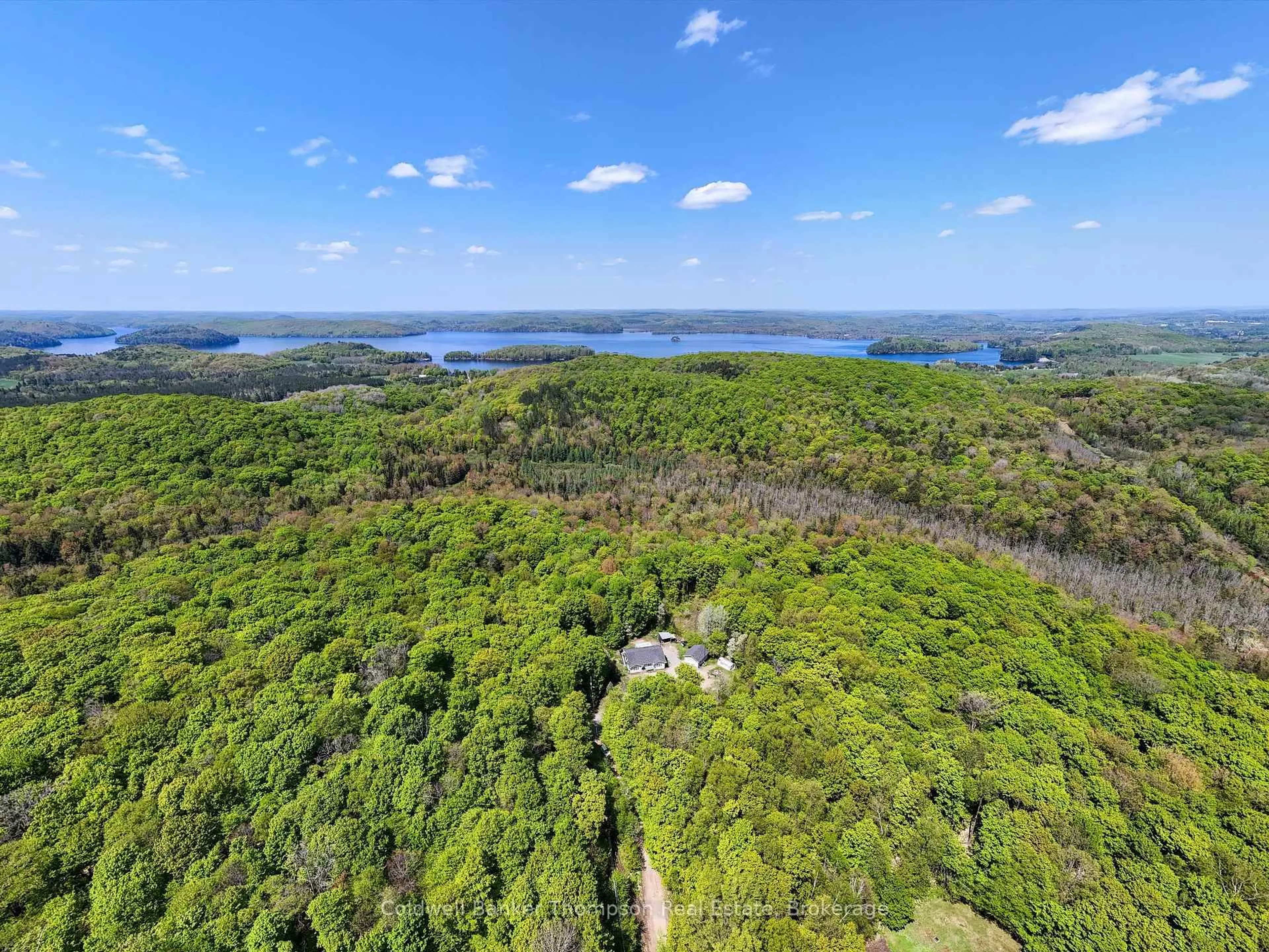A pic from outside/outdoor area/front of a property/back of a property/a pic from drone, water/lake/river/ocean view for 260 Madill Church Rd, Huntsville Ontario P1H 0G8