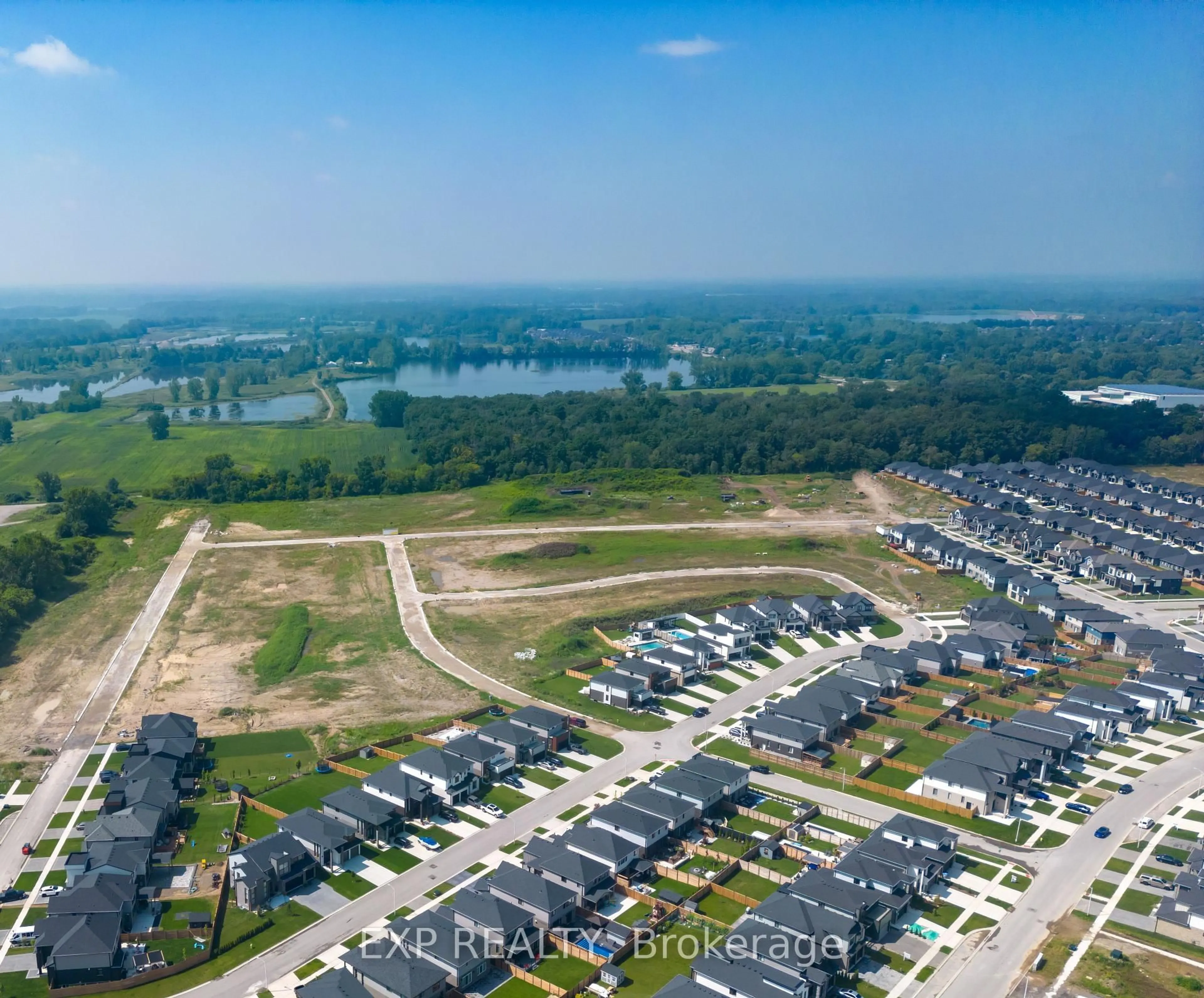 A pic from outside/outdoor area/front of a property/back of a property/a pic from drone, water/lake/river/ocean view for 75 Allister Dr, Middlesex Centre Ontario N0L 1R0