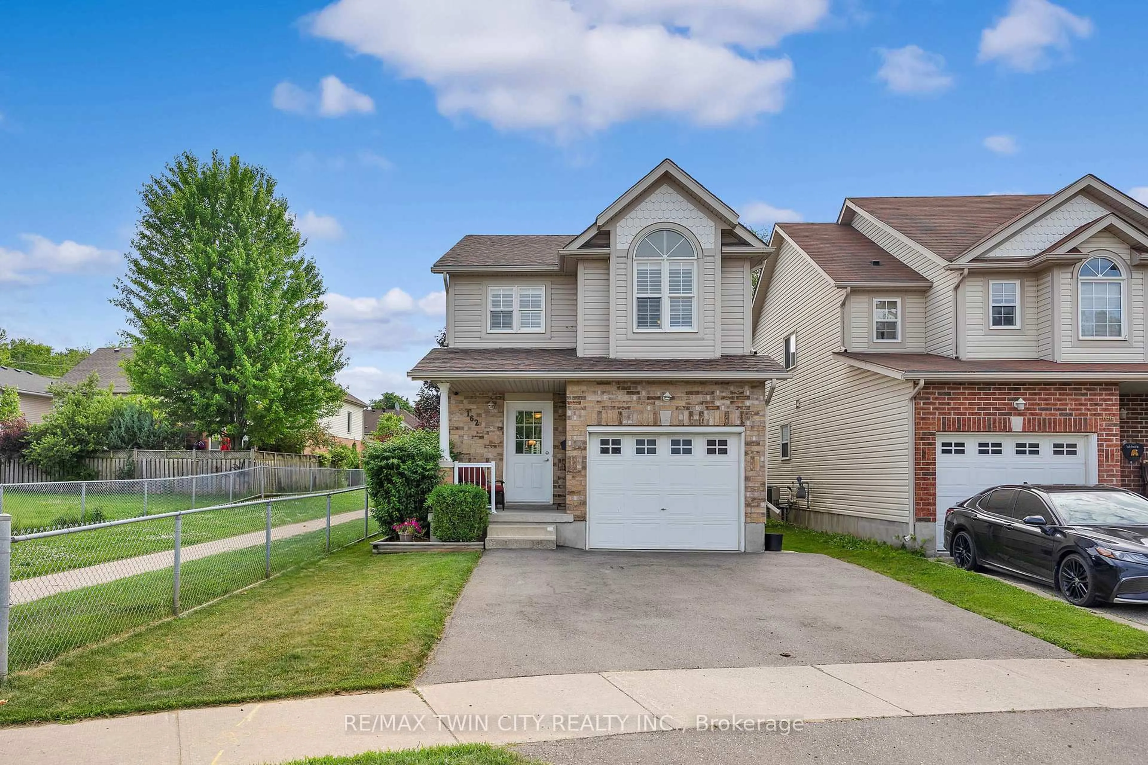 Home with brick exterior material, street for 162 EVERGLADE Cres, Kitchener Ontario N2E 3Y5
