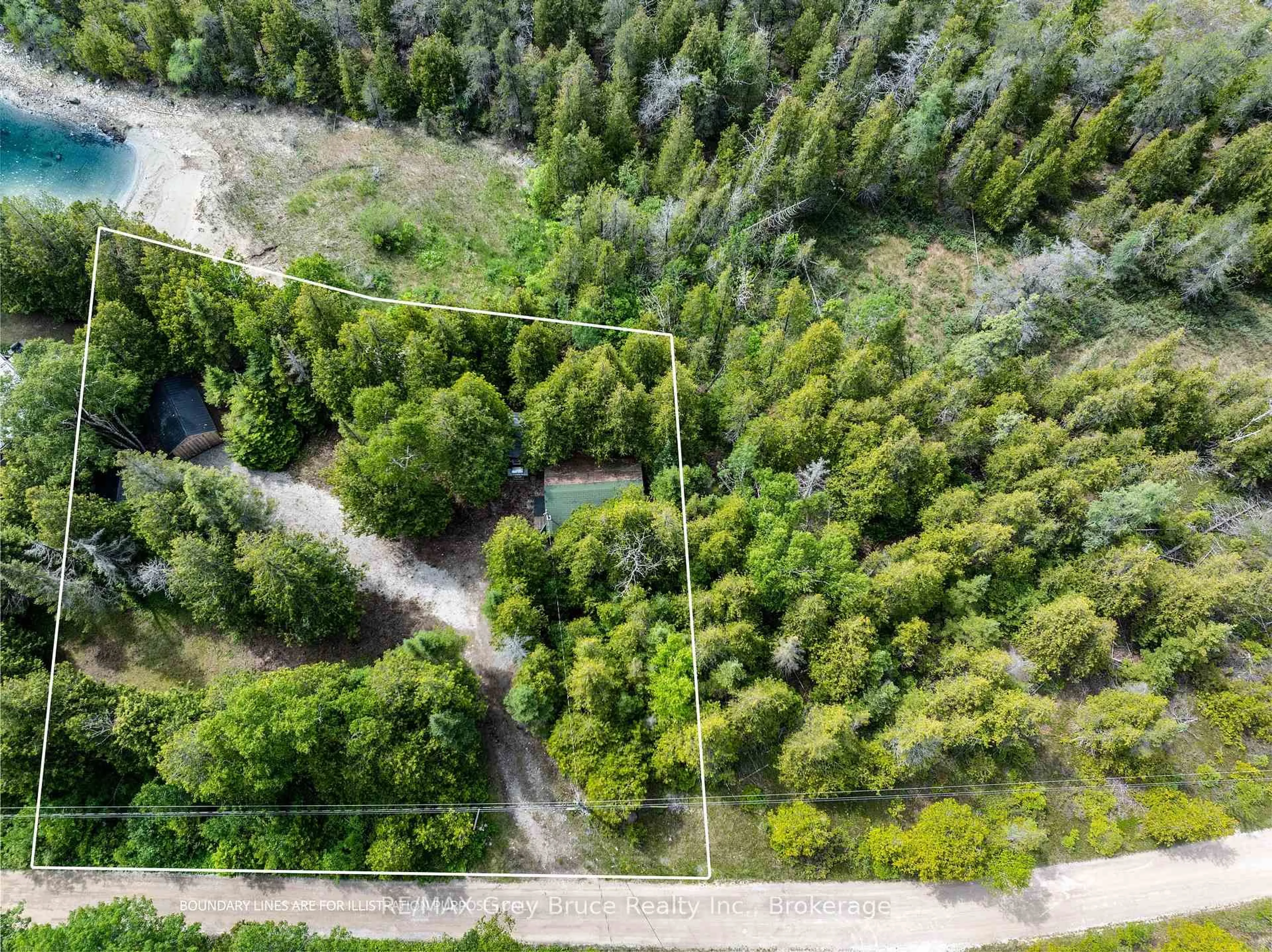 A pic from outside/outdoor area/front of a property/back of a property/a pic from drone, forest/trees view for 24 Howard Bowman Dr, Northern Bruce Peninsula Ontario N0H 2R0