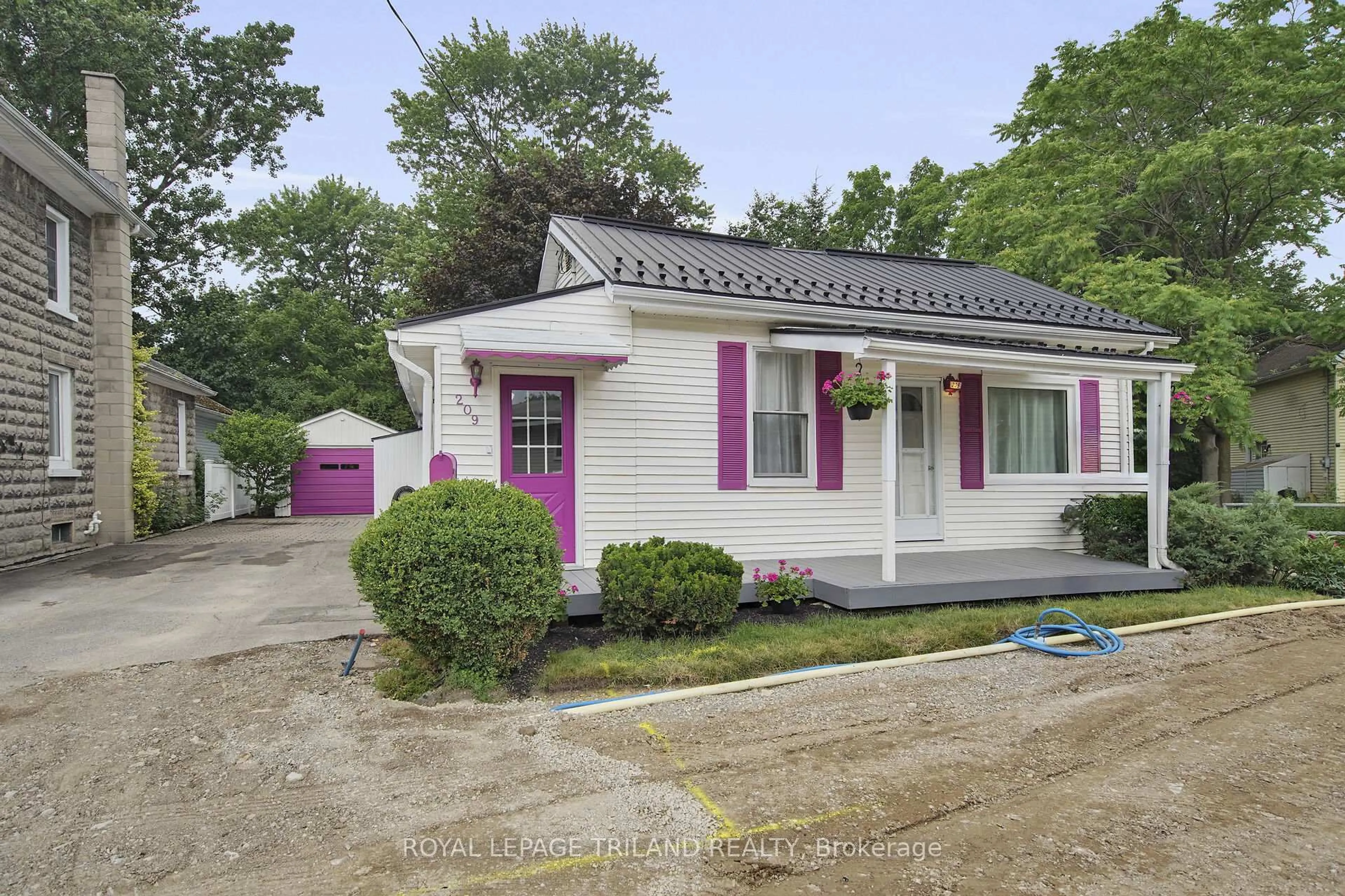 Home with vinyl exterior material, street for 209 Water St, Lucan Biddulph Ontario N0M 2J0