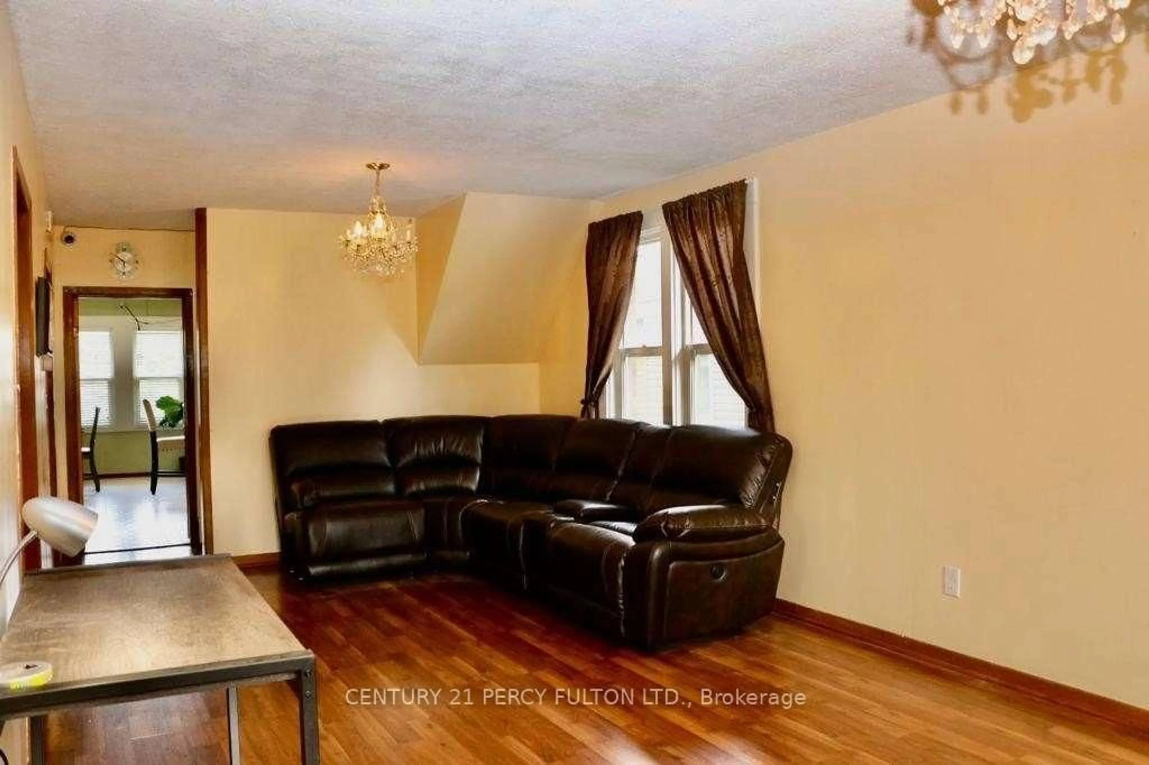 Living room with furniture, wood/laminate floor for 5991 Culp St, Niagara Falls Ontario L2G 2B6