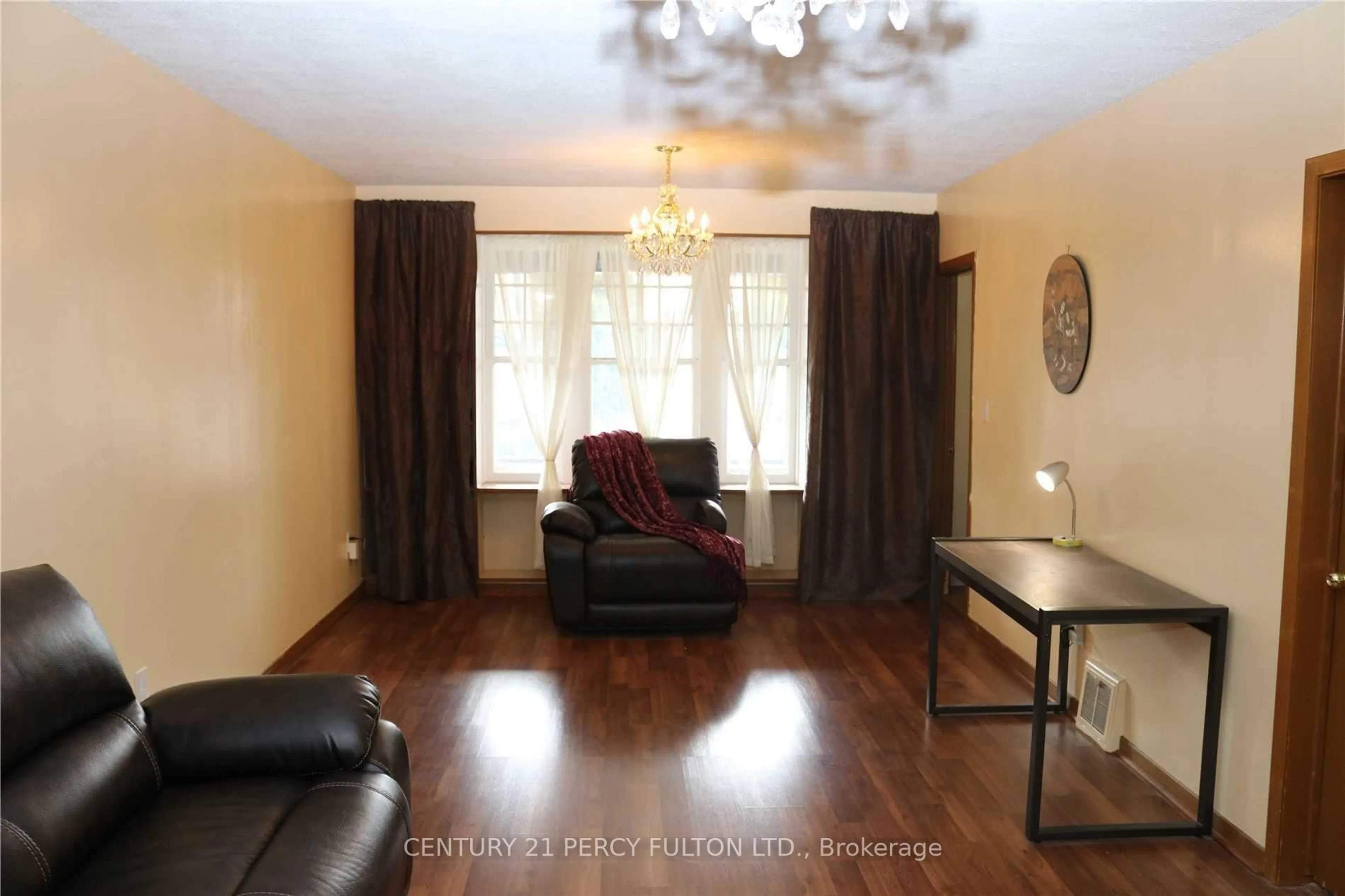 Living room with furniture, wood/laminate floor for 5991 Culp St, Niagara Falls Ontario L2G 2B6