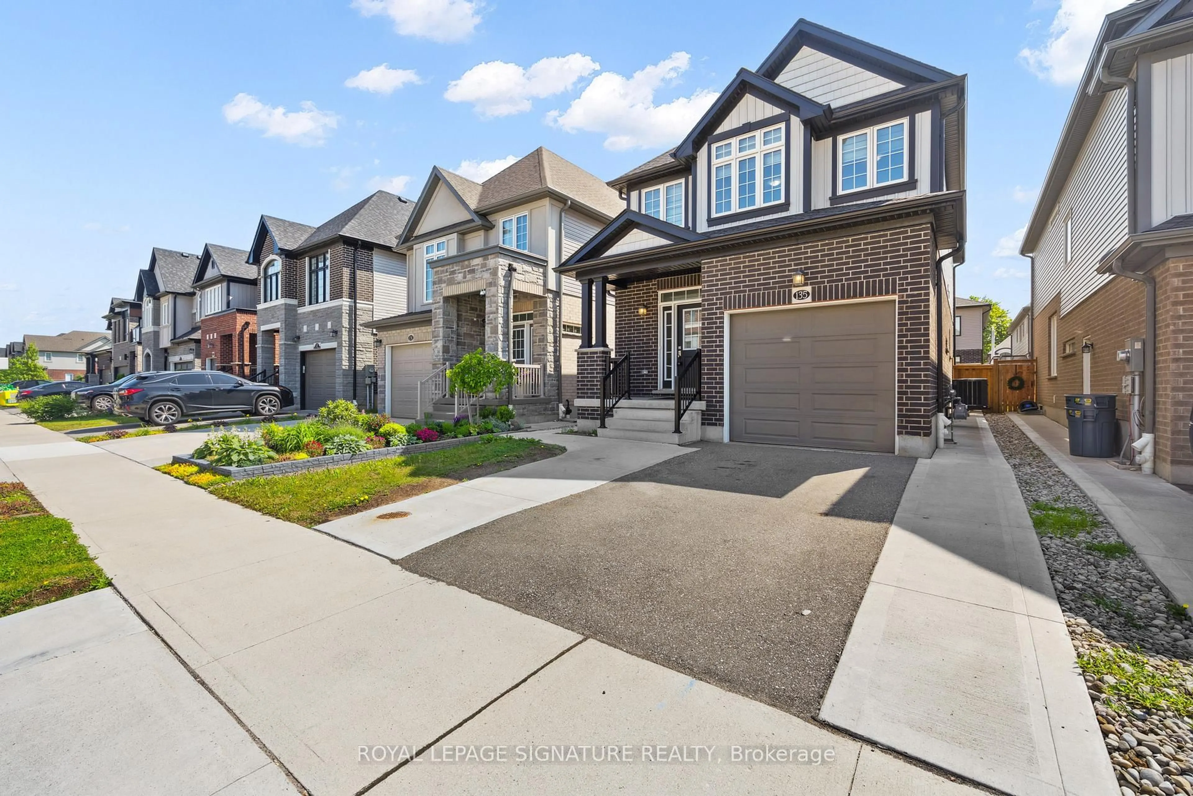 Home with vinyl exterior material, street for 135 Ian Ormston Dr, Kitchener Ontario N2P 0K3