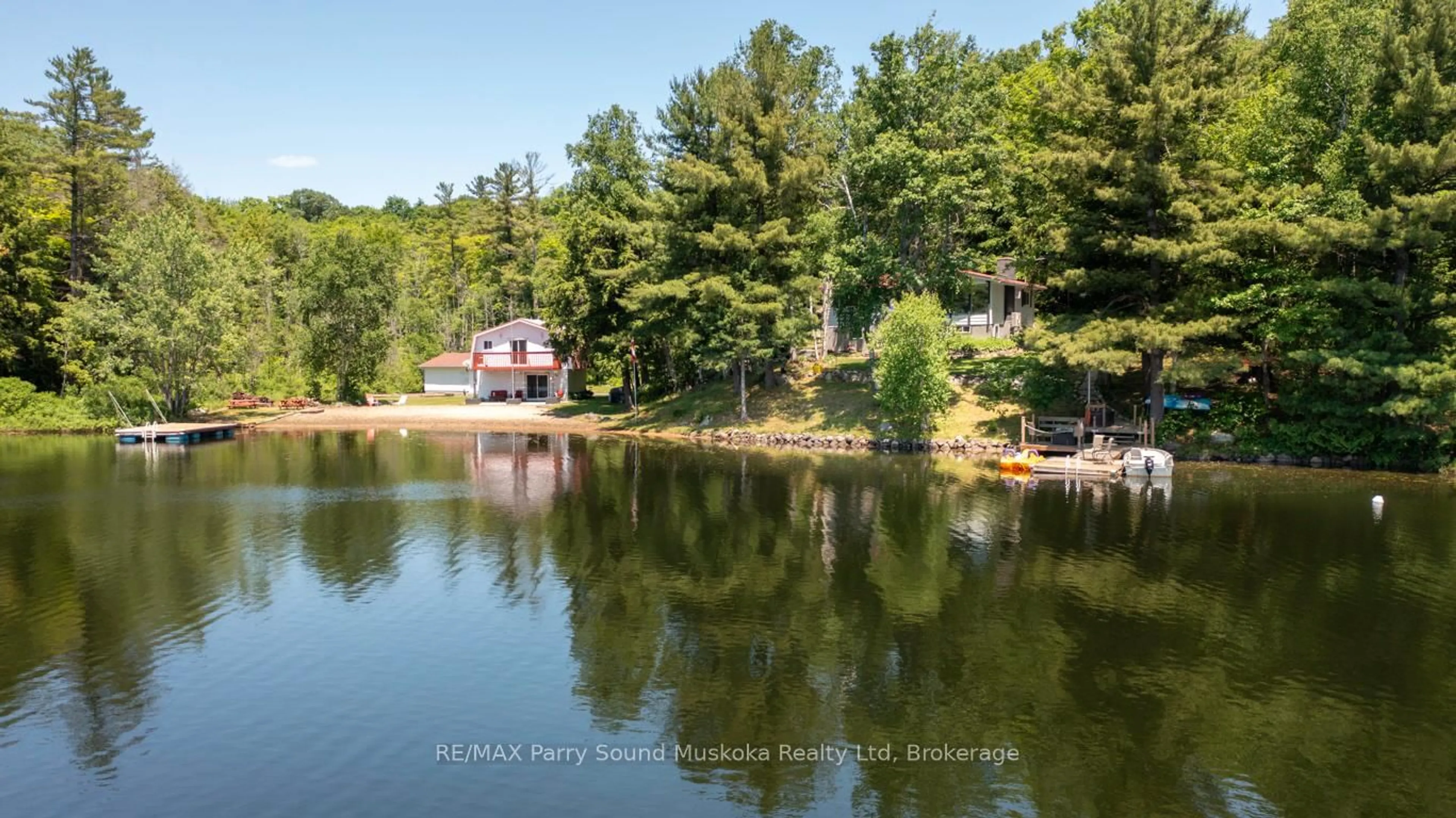 A pic from outside/outdoor area/front of a property/back of a property/a pic from drone, water/lake/river/ocean view for 18 Karhu Lane, Seguin Ontario P2A 2W8