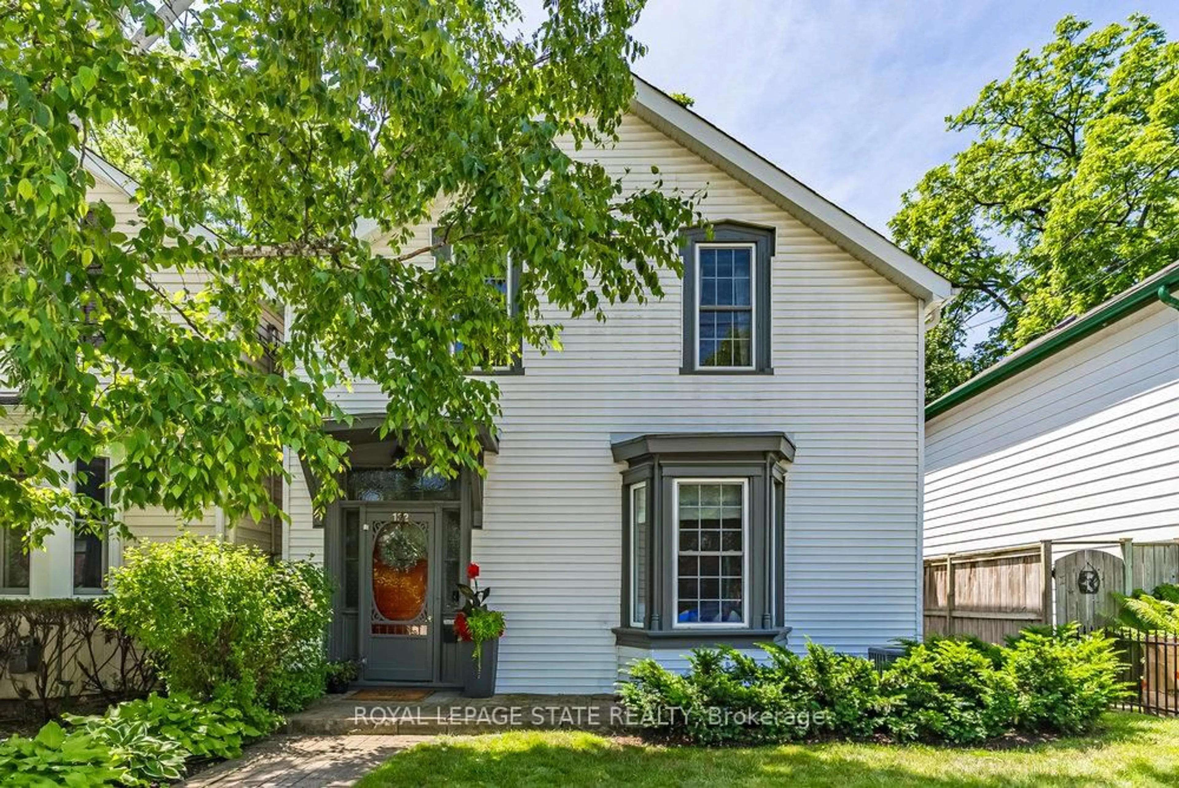 Home with vinyl exterior material, street for 132 Park St, Hamilton Ontario L9H 1X7