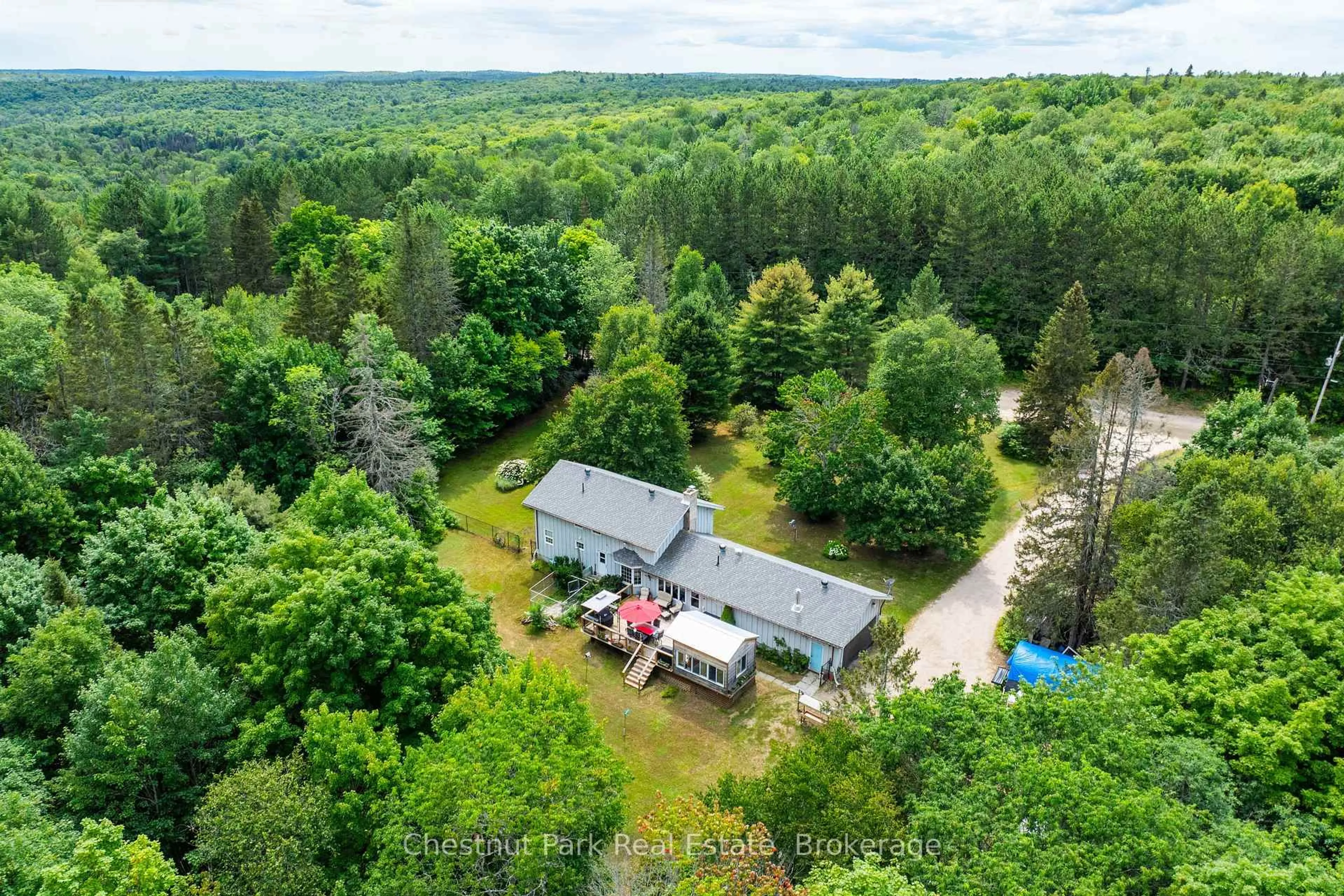 A pic from outside/outdoor area/front of a property/back of a property/a pic from drone, forest/trees view for 269 Old Muskoka Rd, Machar Ontario P0A 1H0