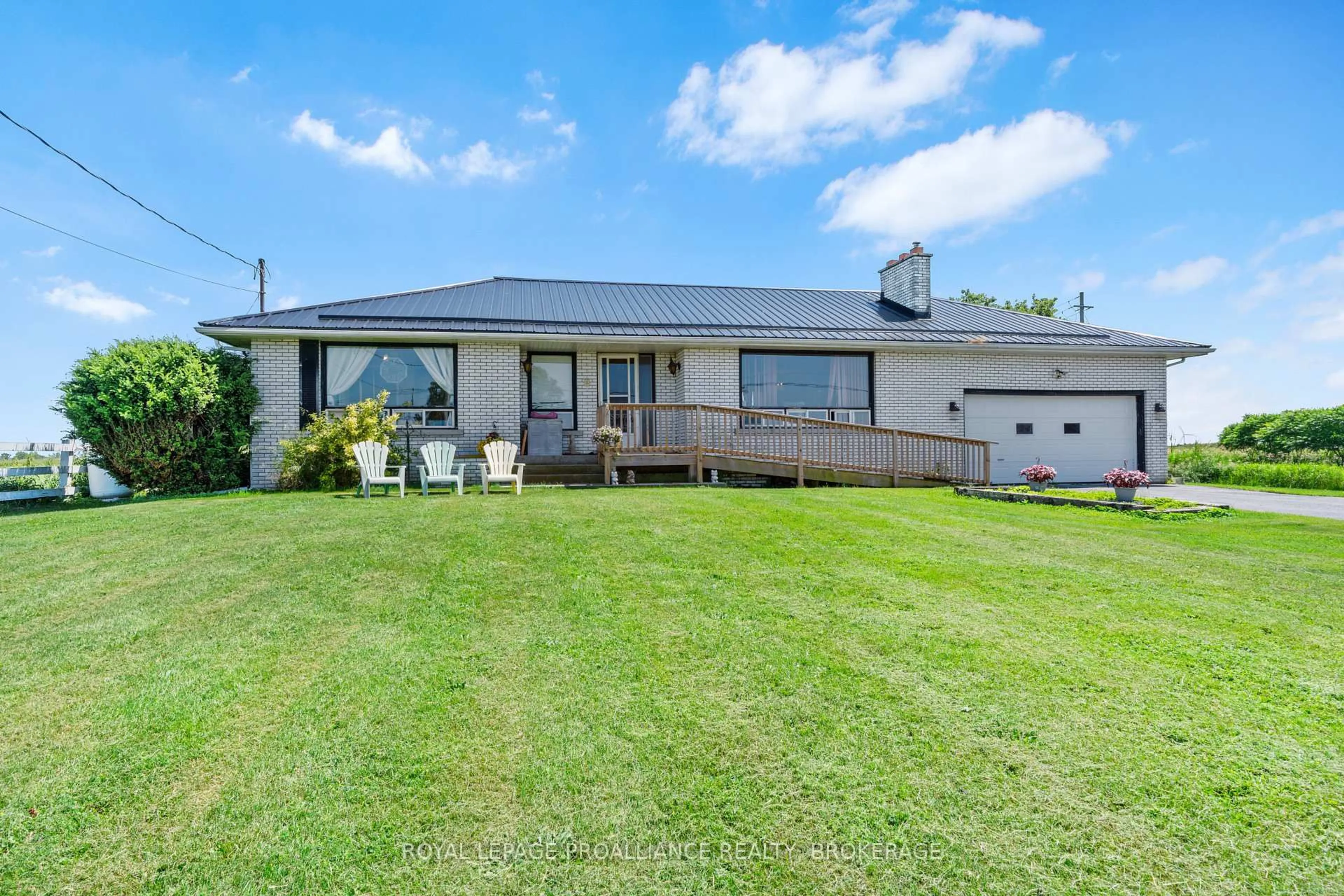 A pic from outside/outdoor area/front of a property/back of a property/a pic from drone, unknown for 631 Highway 96, Wolfe Island Ontario K0H 2Y0