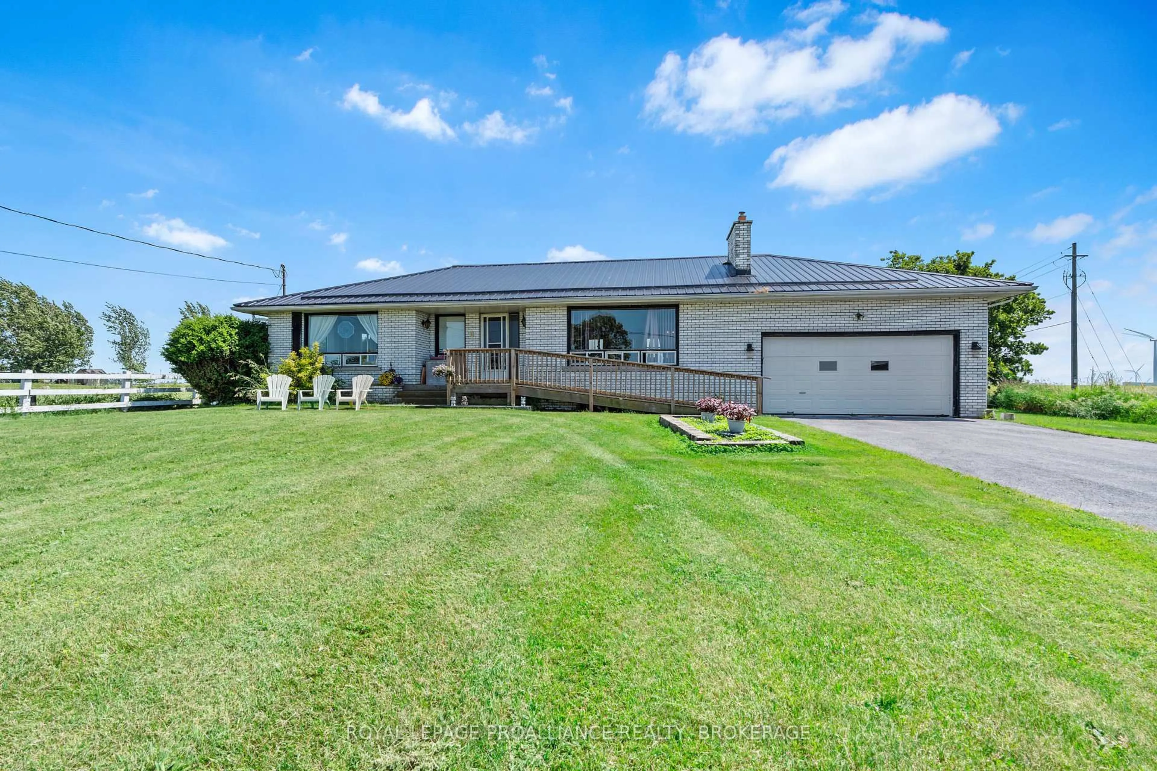 A pic from outside/outdoor area/front of a property/back of a property/a pic from drone, water/lake/river/ocean view for 631 Highway 96, Wolfe Island Ontario K0H 2Y0